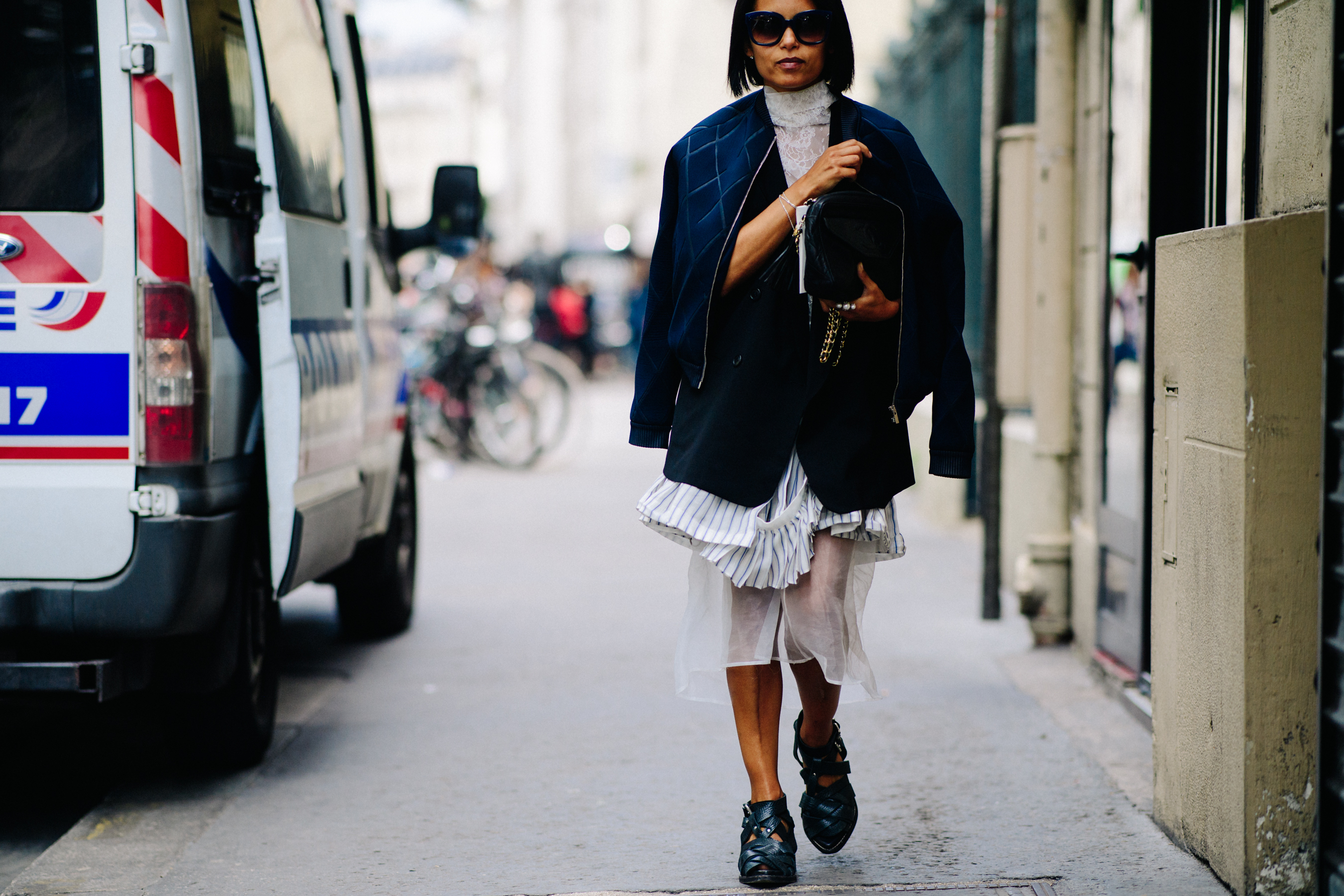 Woman wearing blue bomber jacket