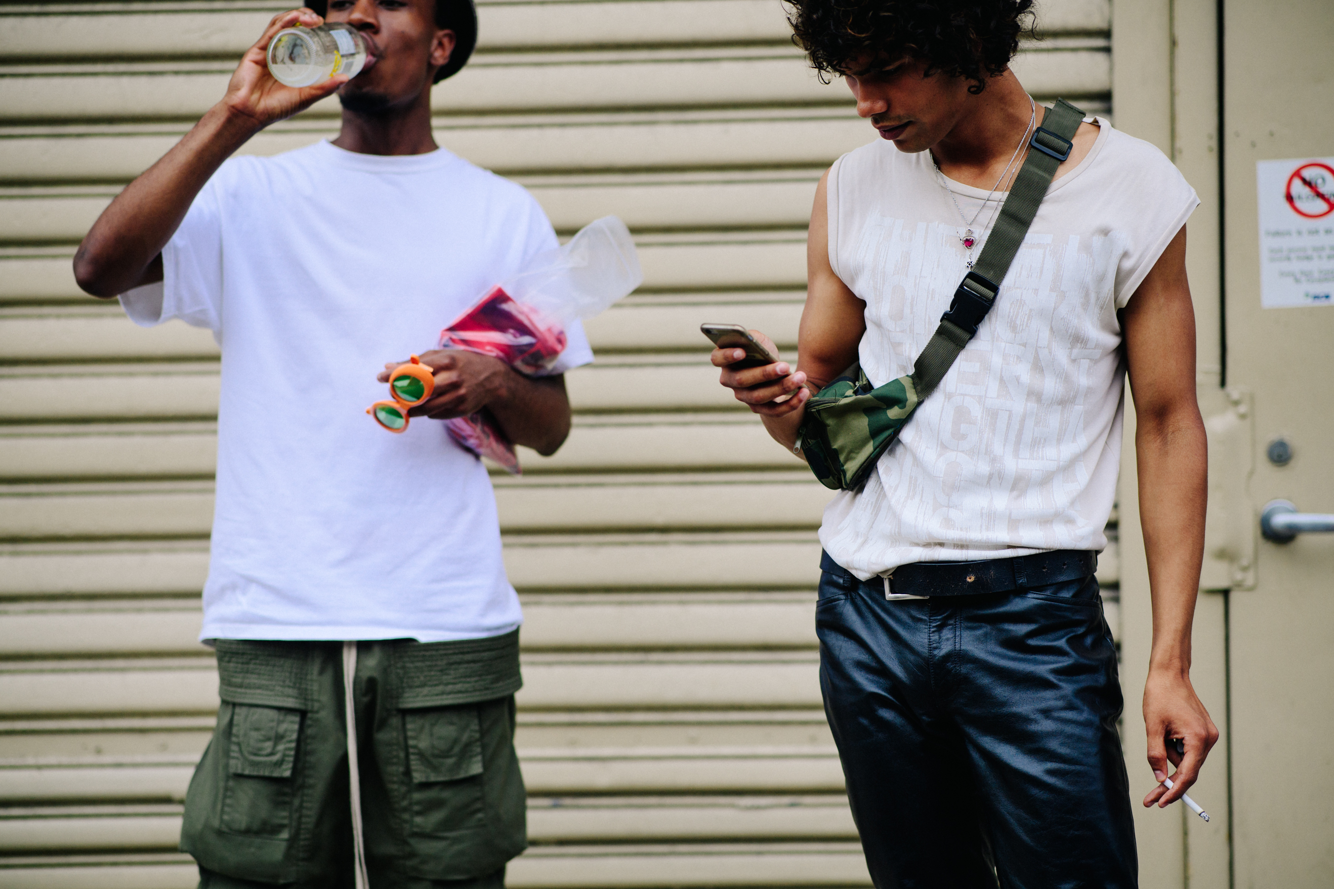 Two male models wearing white shirts