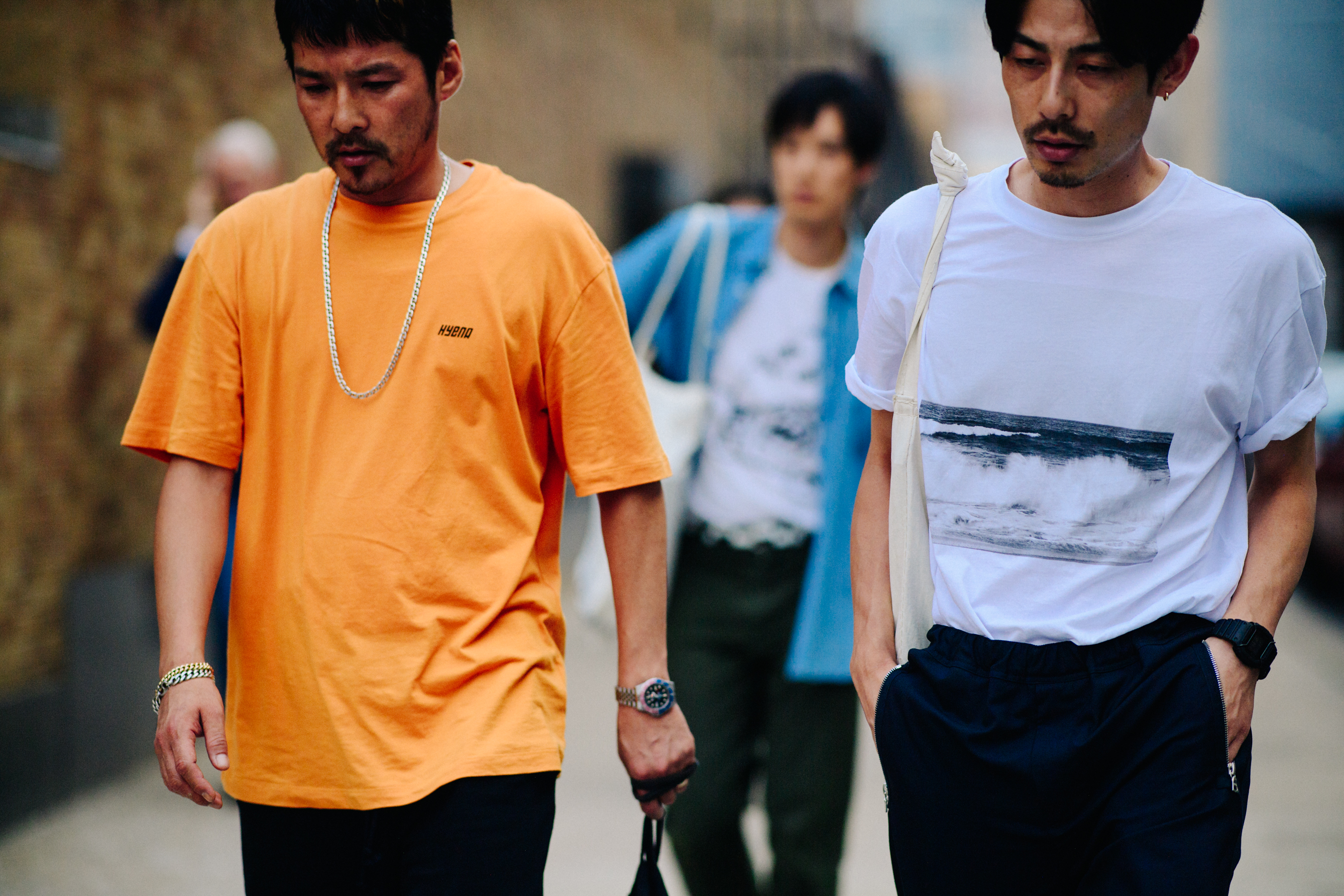 Two men wearing t-shirts