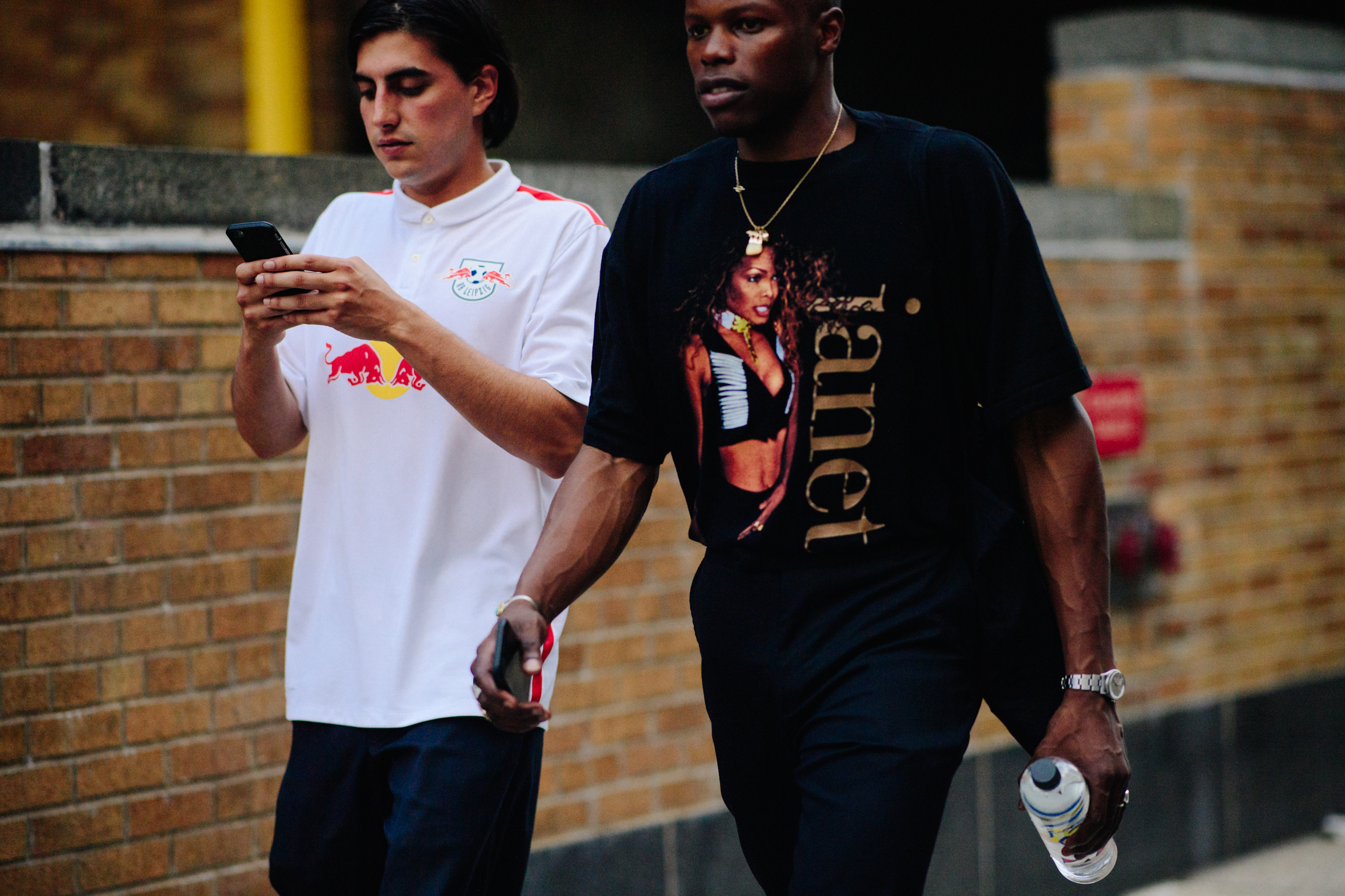 Two men wearing printed t-shirts