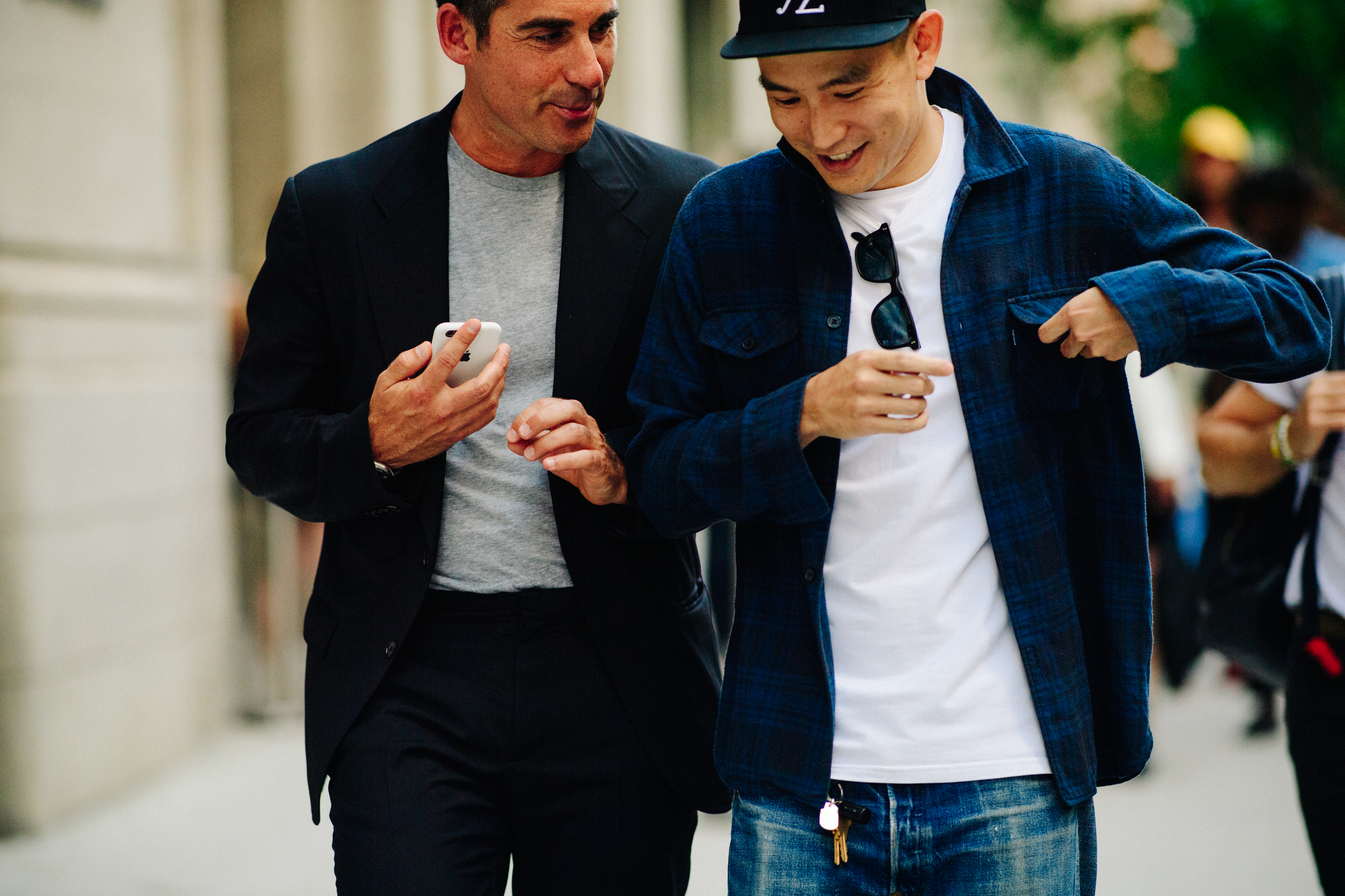 Two men wearing dark clothes