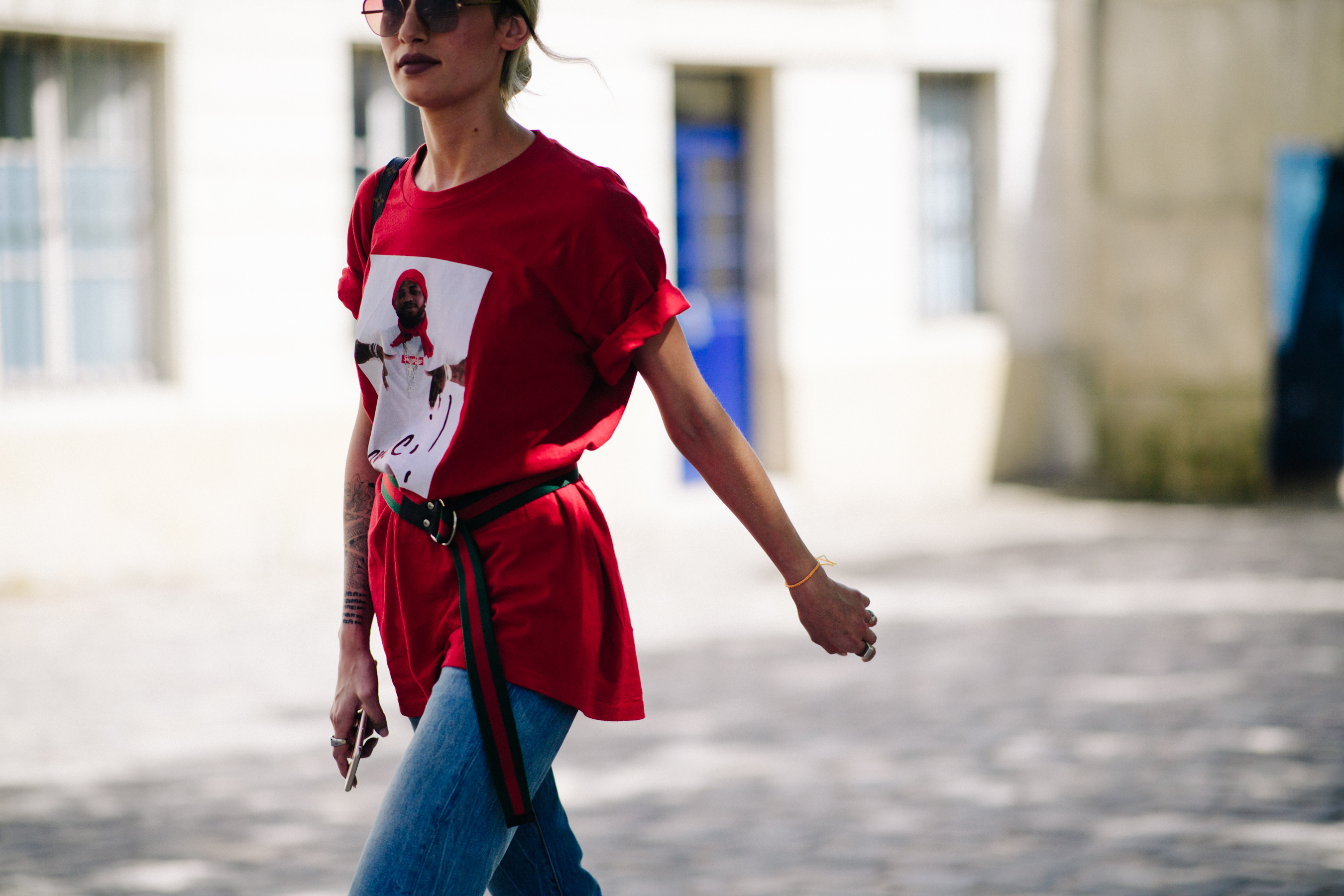 Woman wearing an oversized Supreme t-shirt