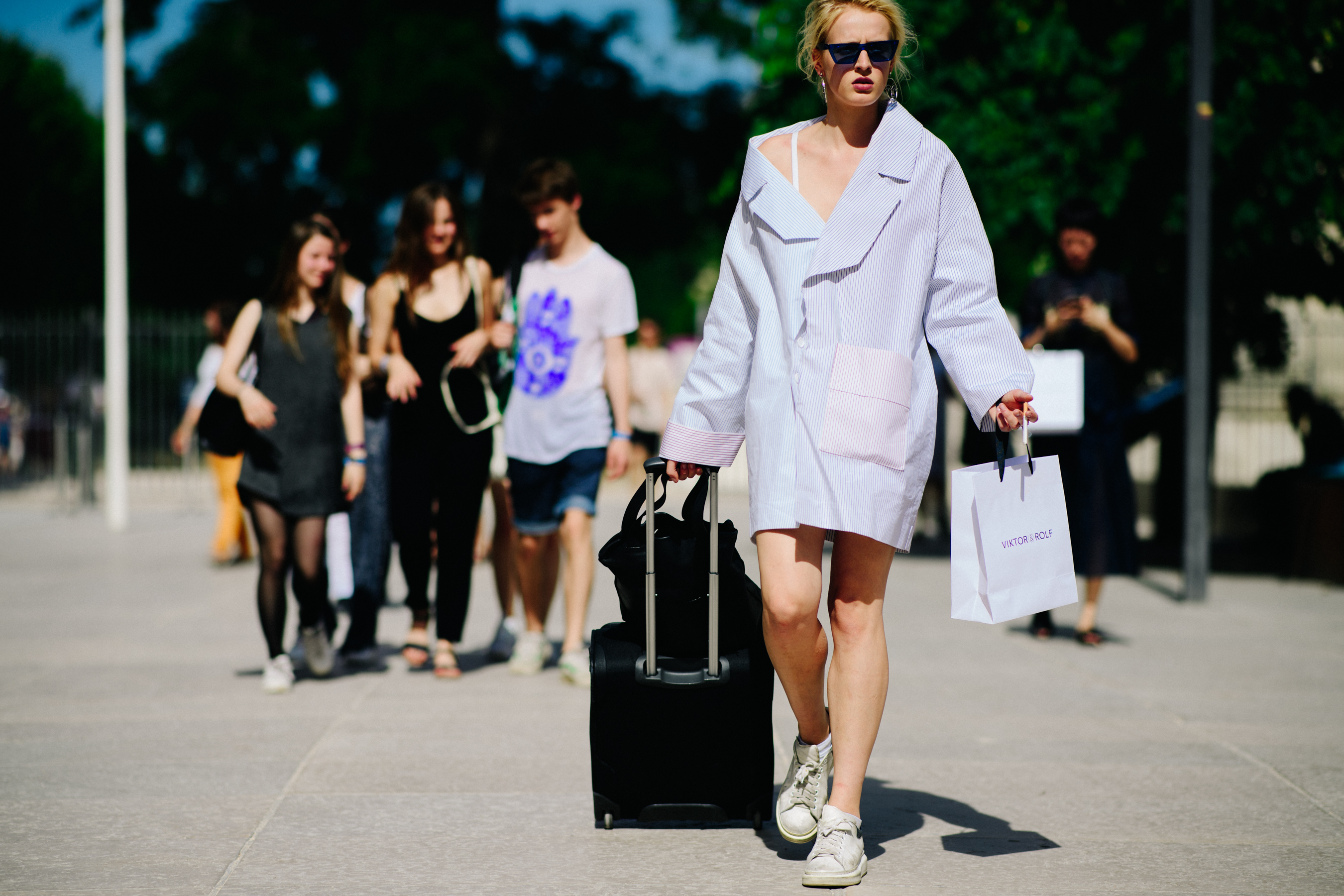 Woman carrying a Viktor & Rolf paper bag