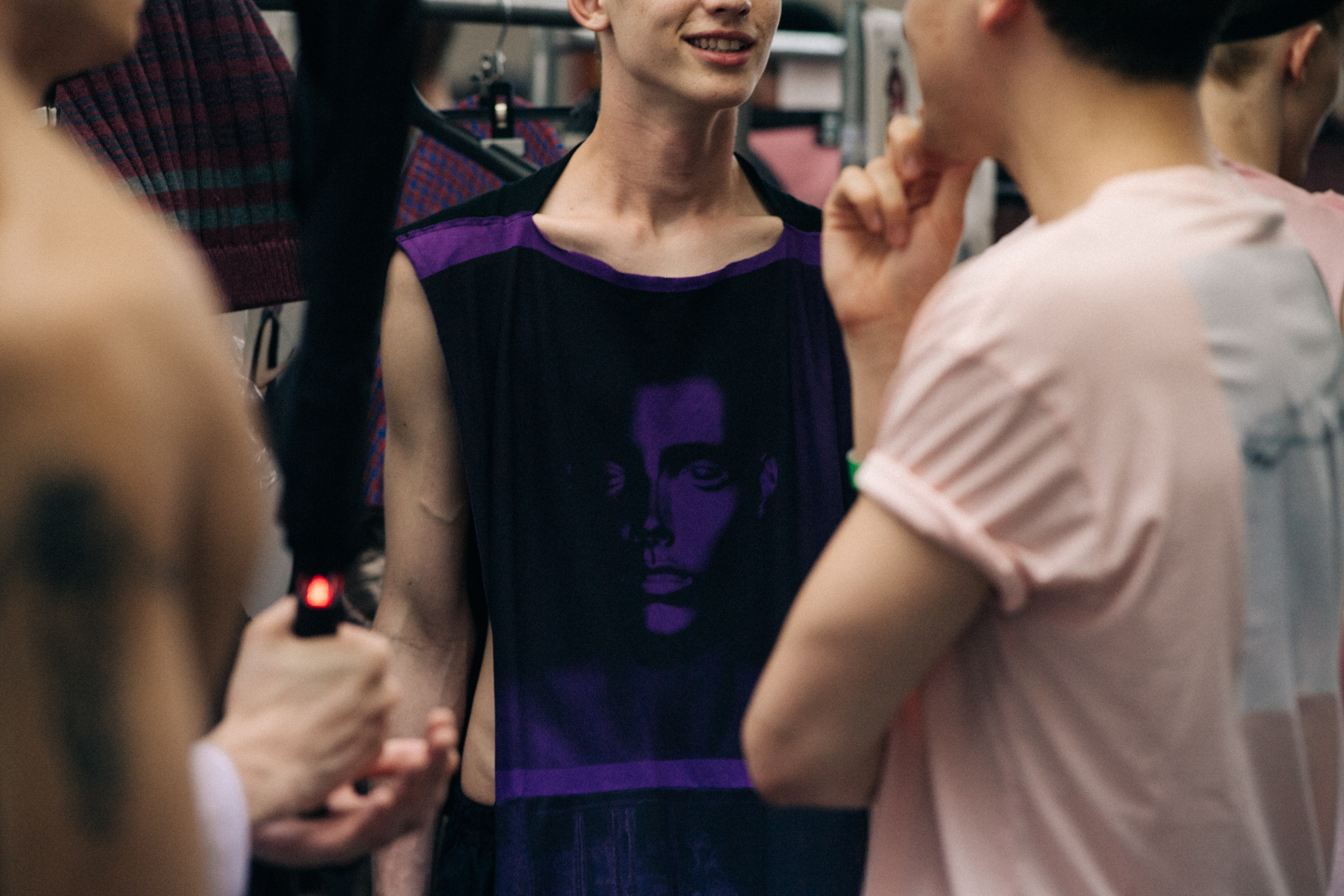 Male odel wearing purple top
