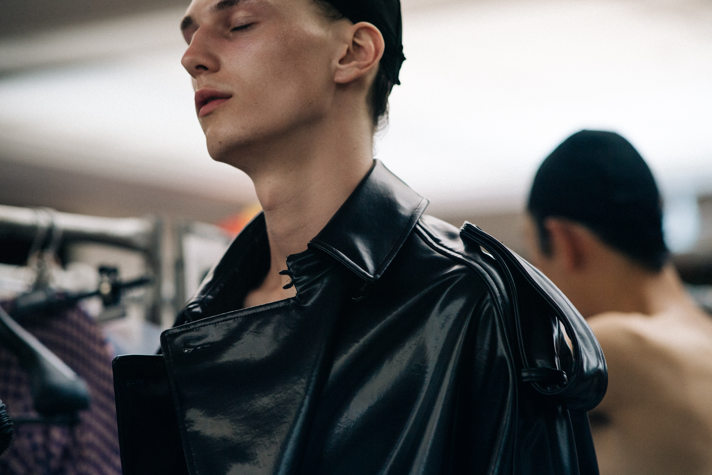 Male model wearing black leather coat