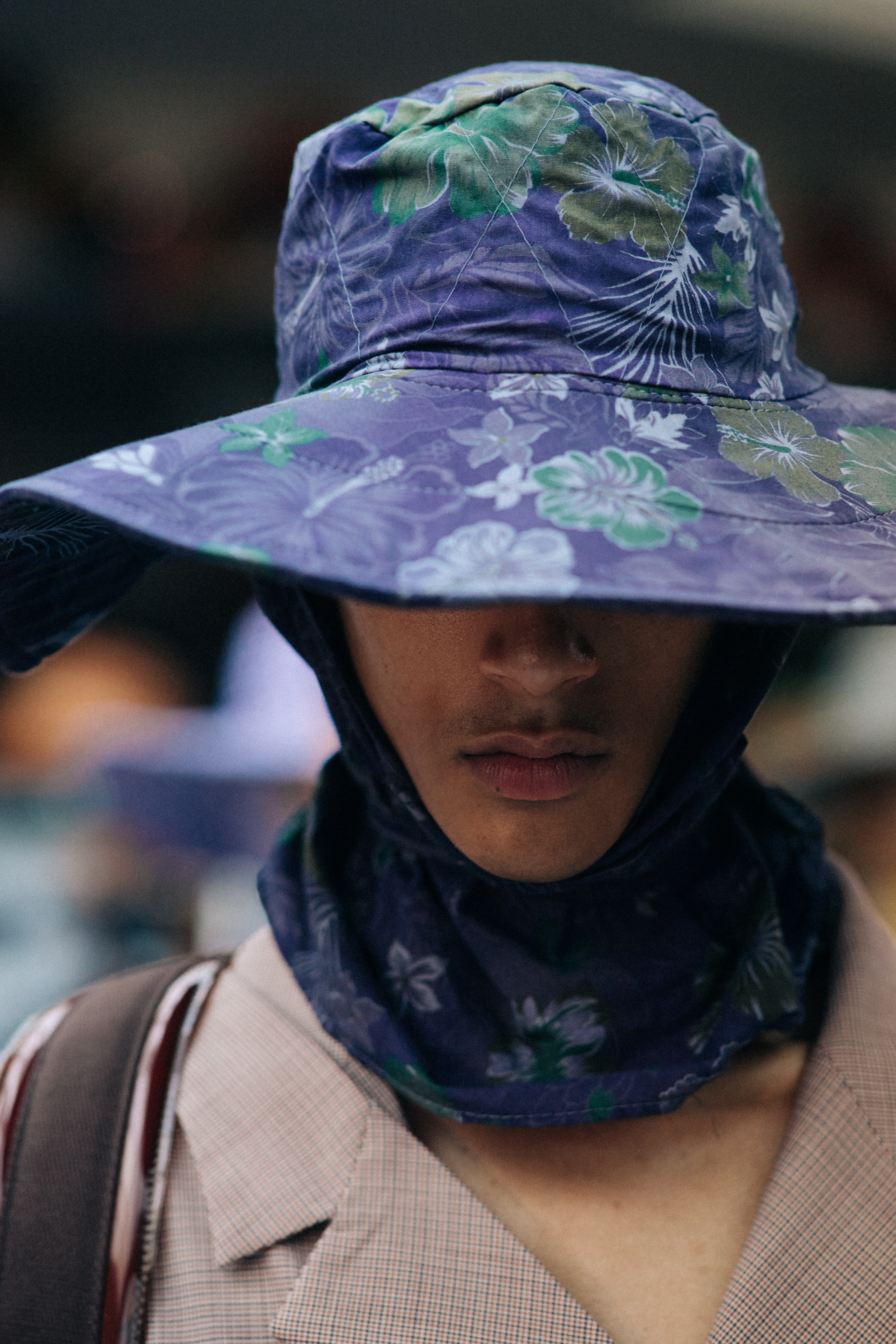 Male model wearing purple fishing hat