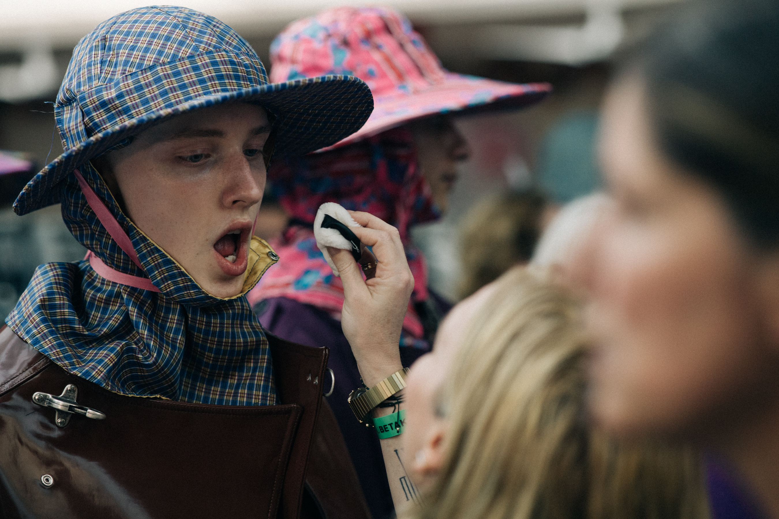 Group of models dressed before a show
