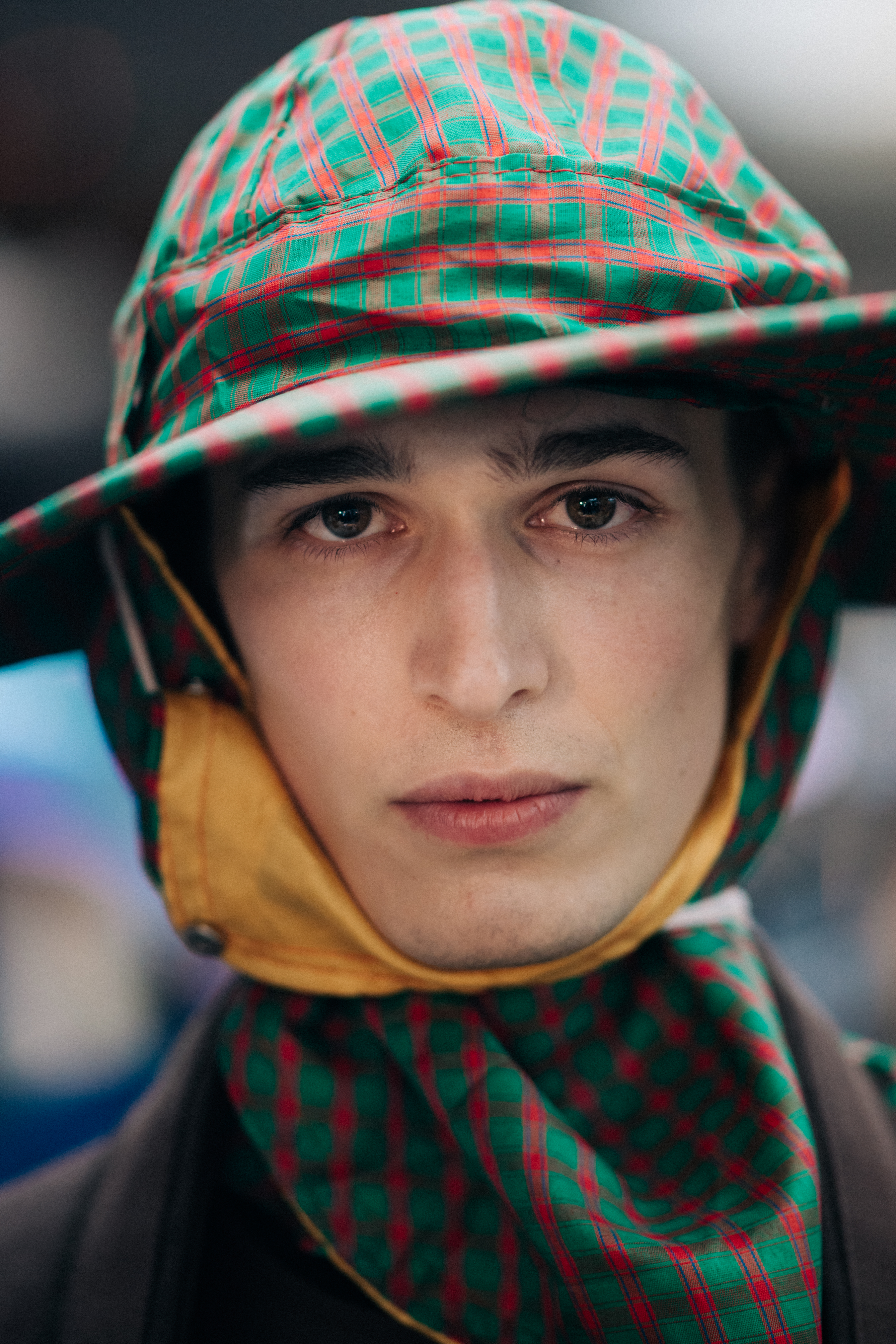 Male model wearing green rain hat