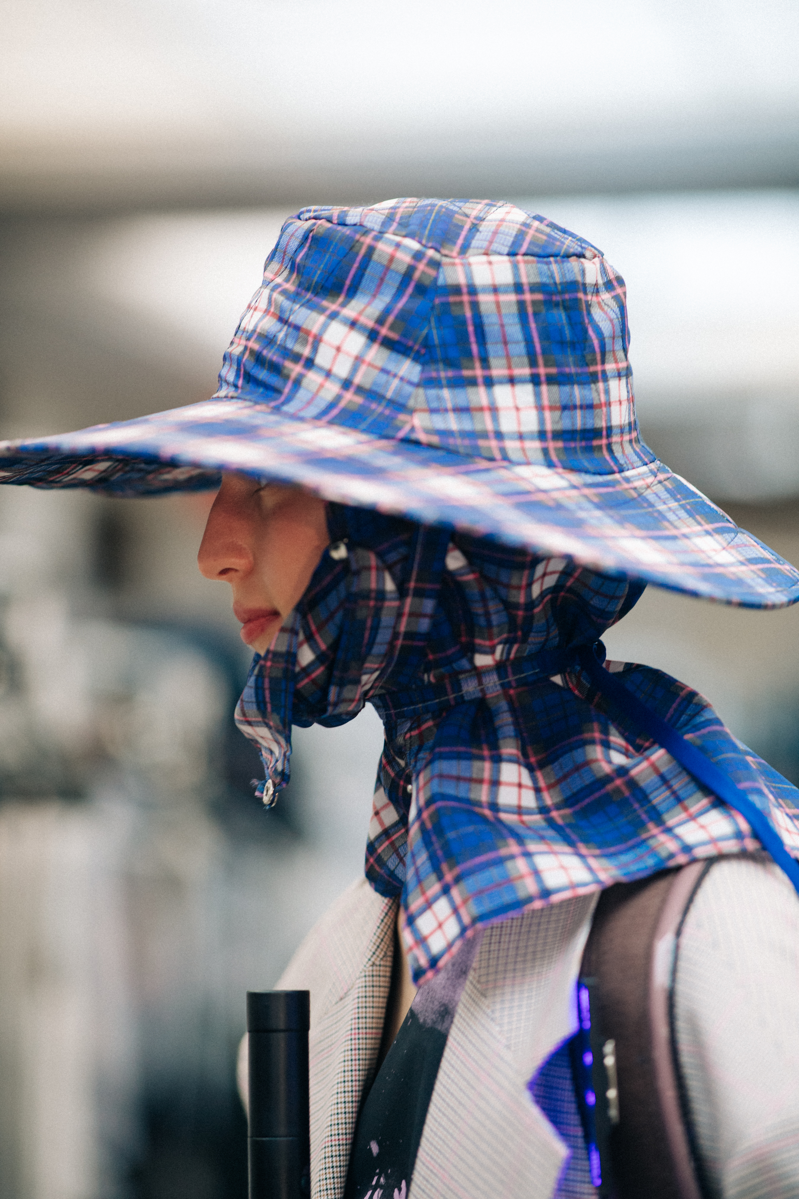 Model wearing rain hat