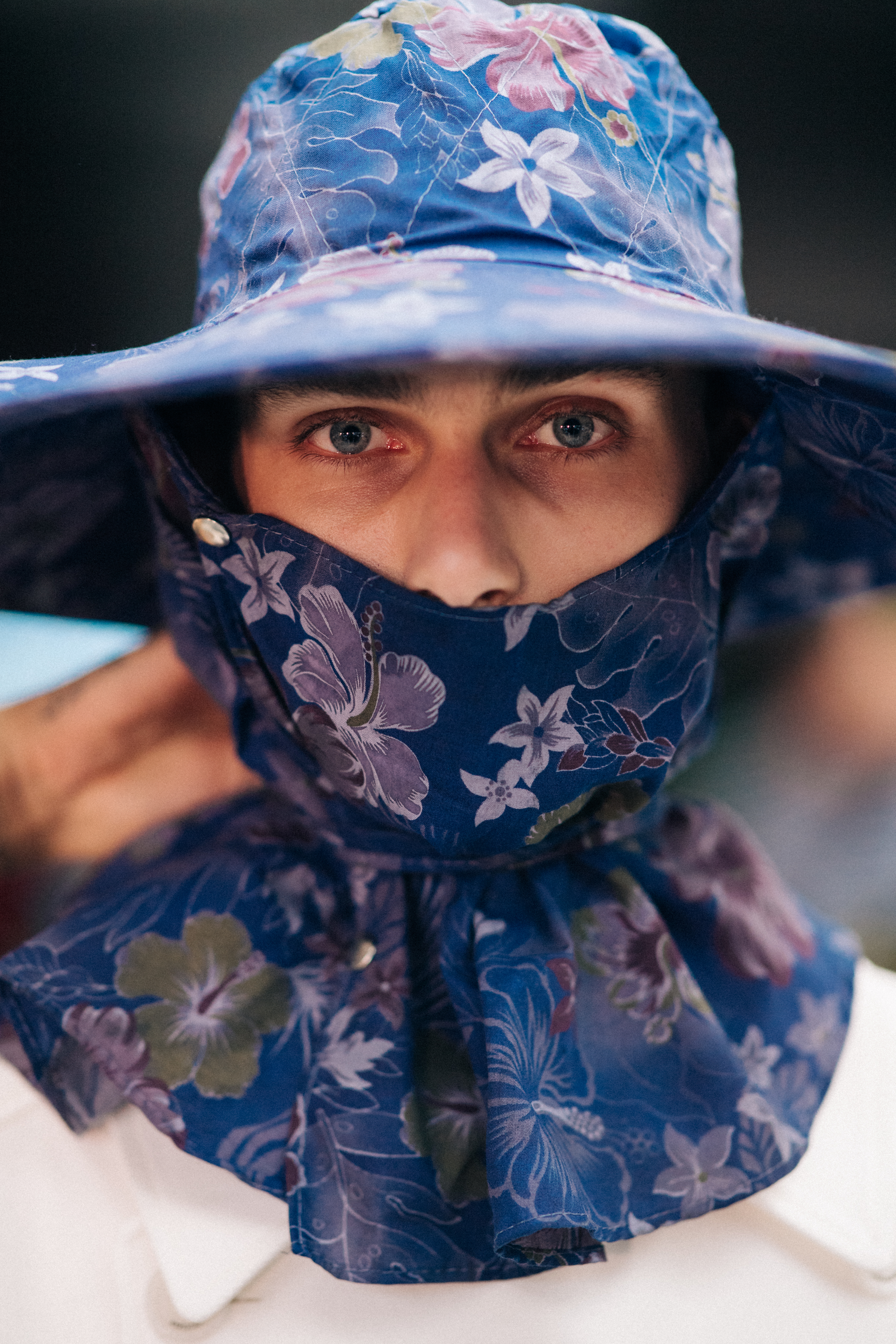 Model wearing rain hat