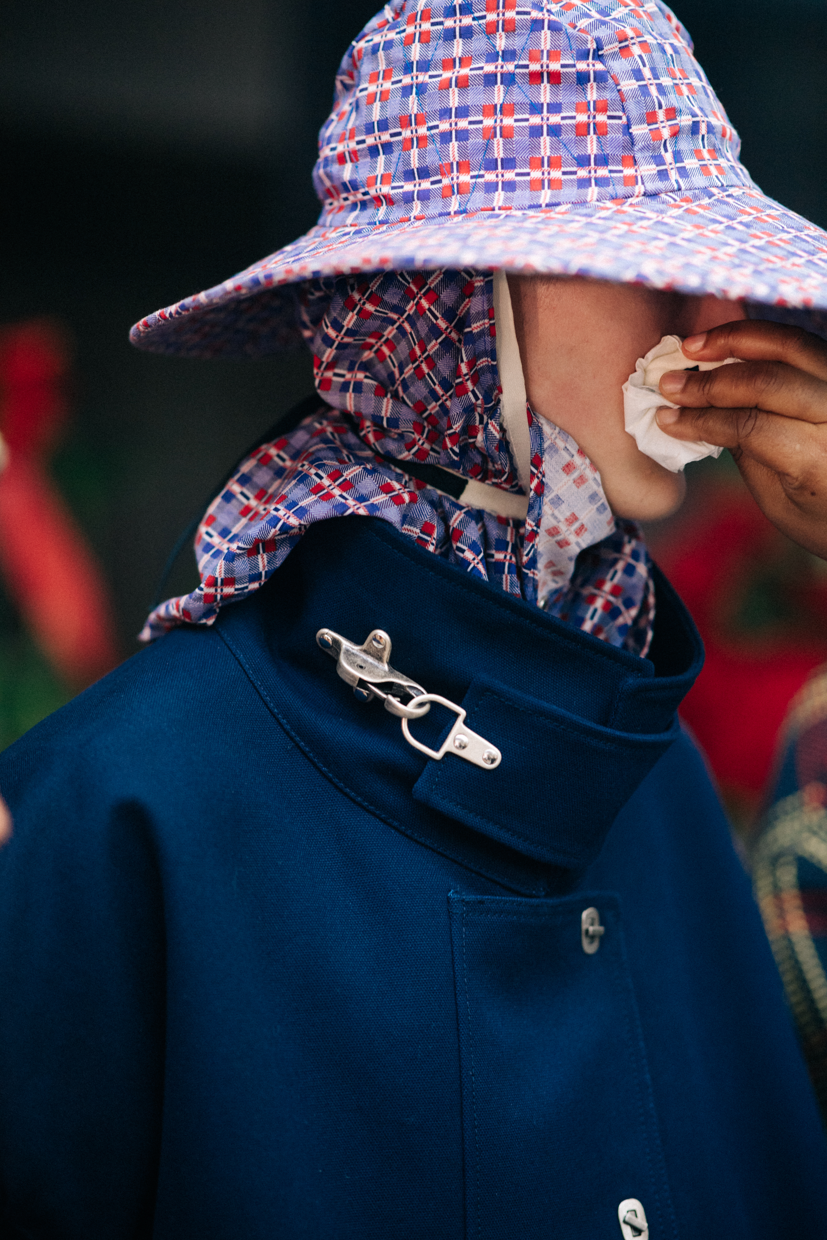 Model wearing rain hat