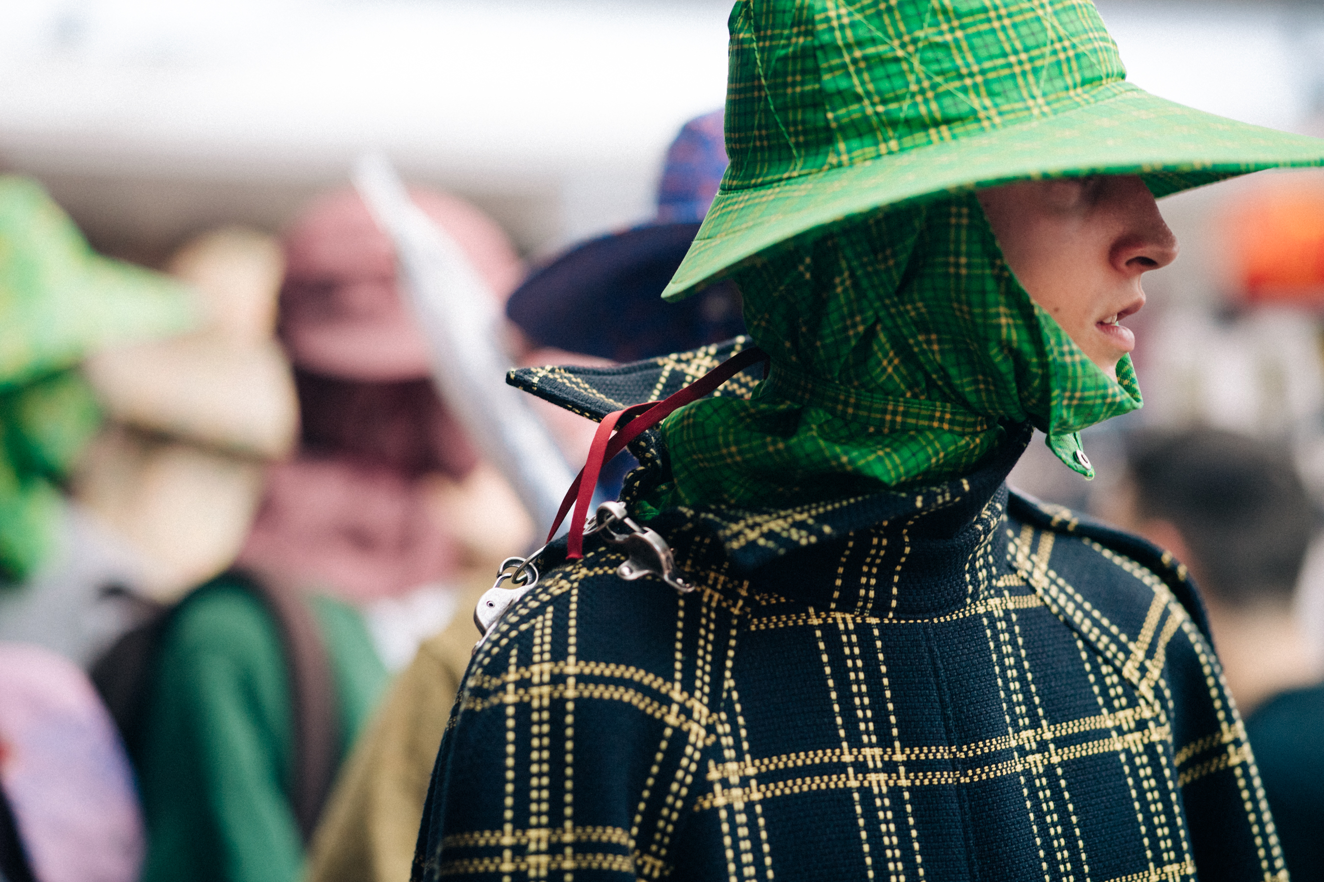 Model wearing rain hat