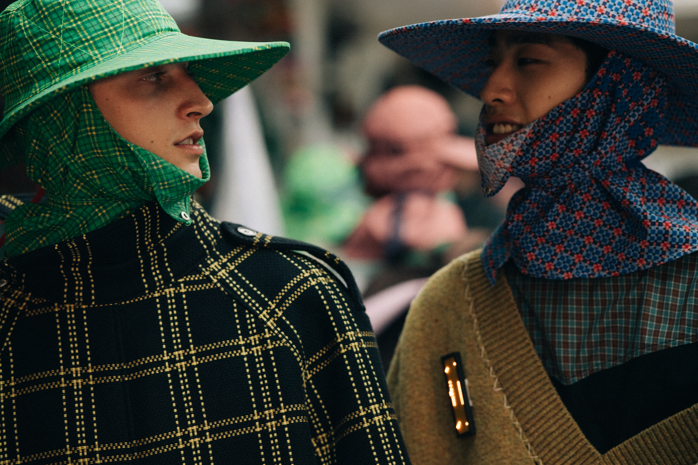 Male model wearing green rain hat