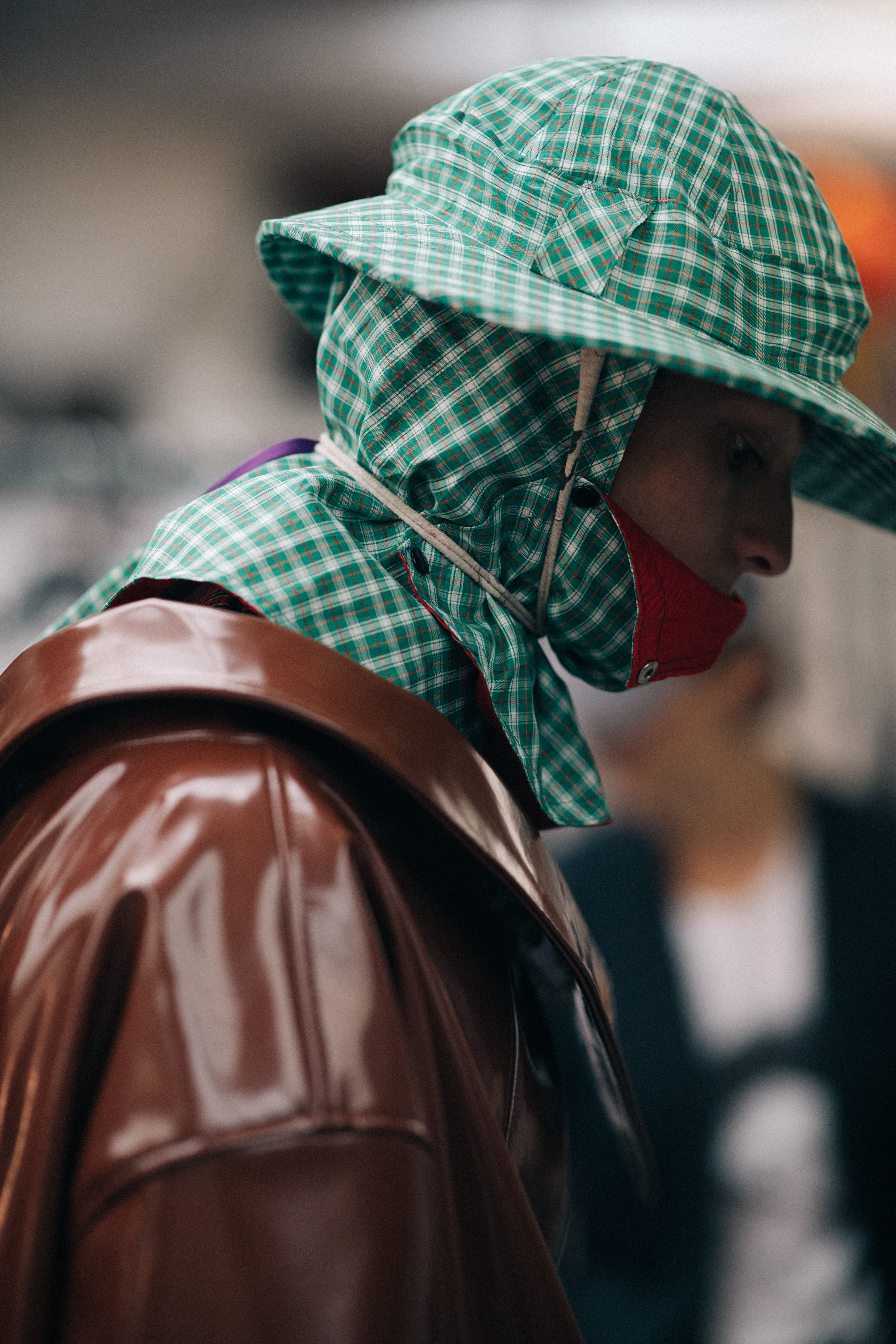 Models wearing rain hats and coats