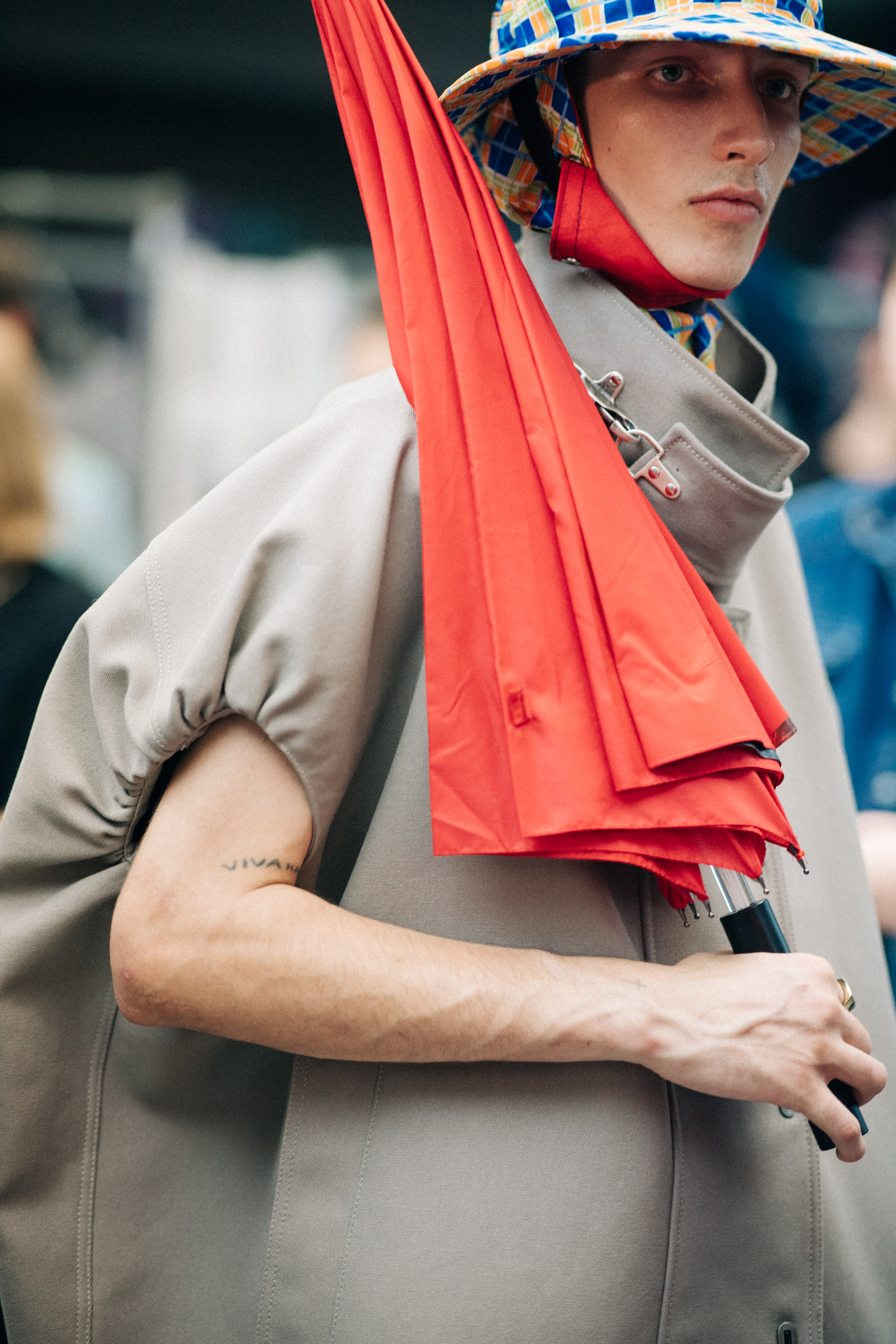 Models wearing rain hats and coats