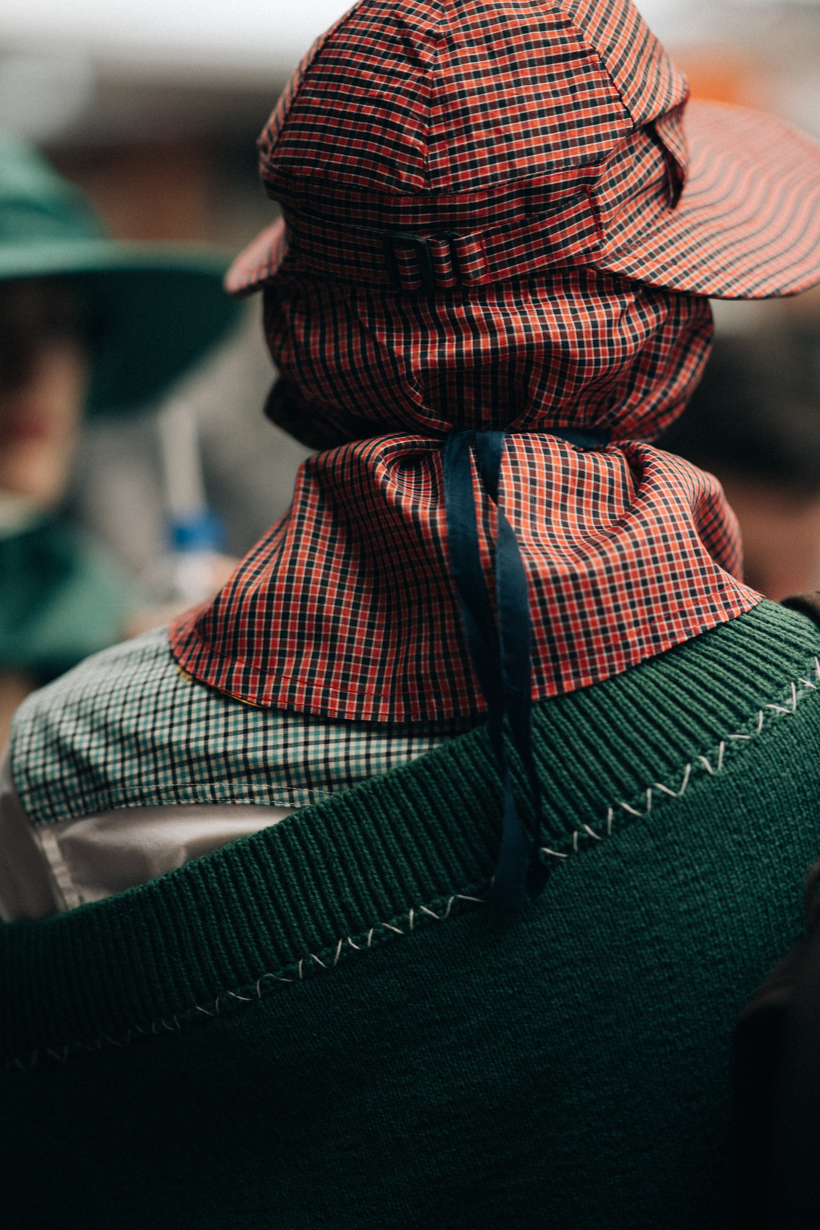 Male model wearing rain hat and coat