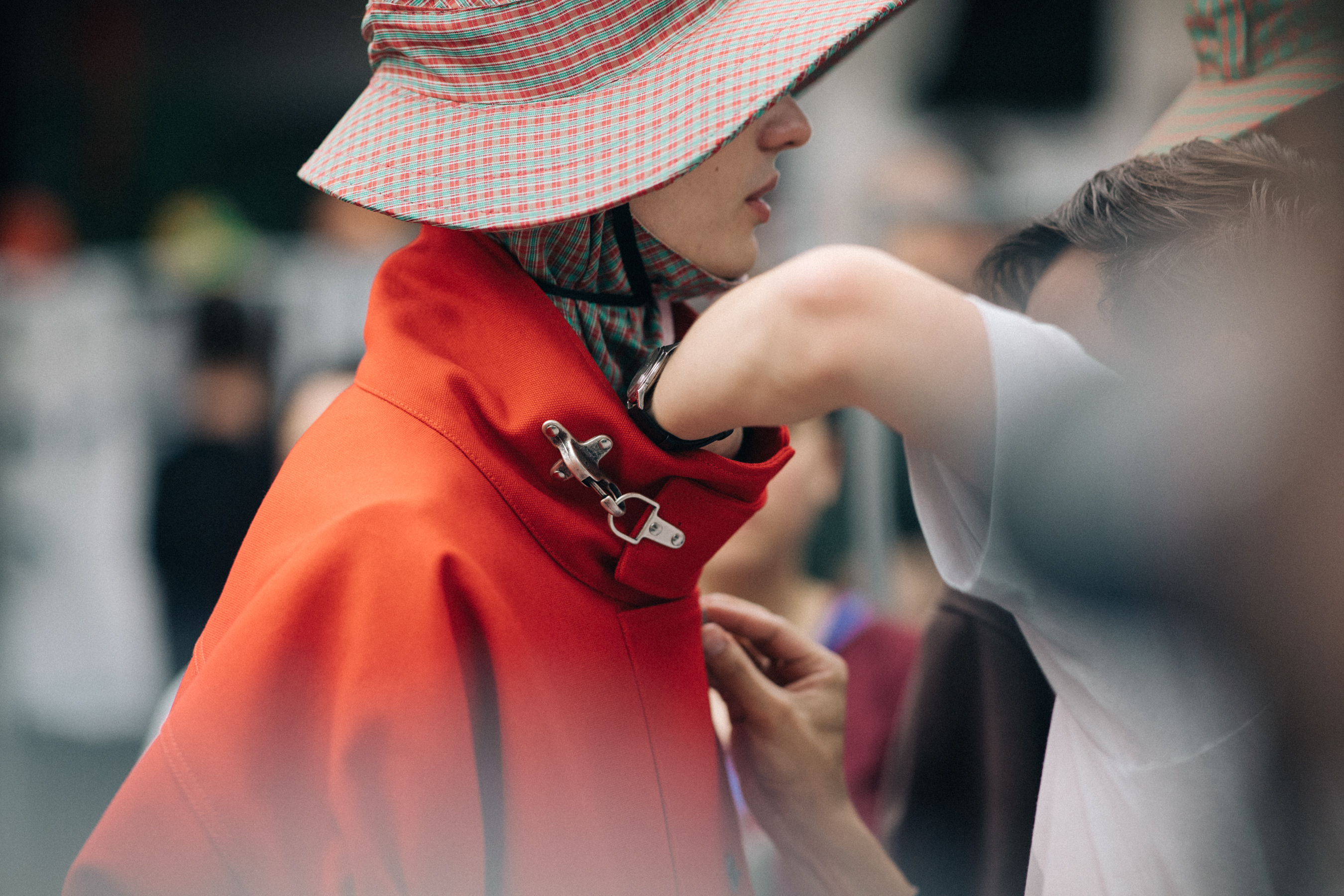 Male model wearing rain hat and coat