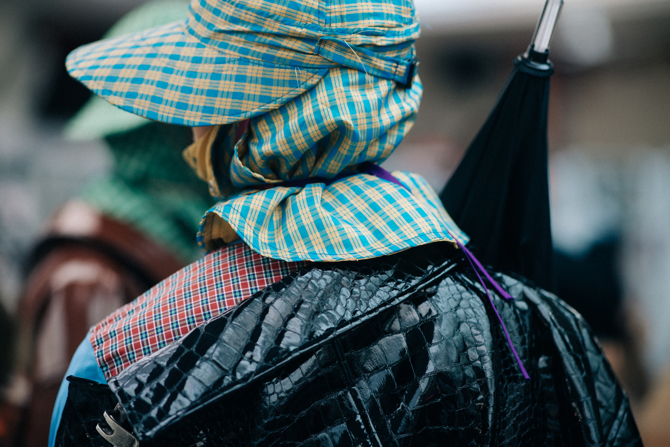 Male model wearing rain hat and coat