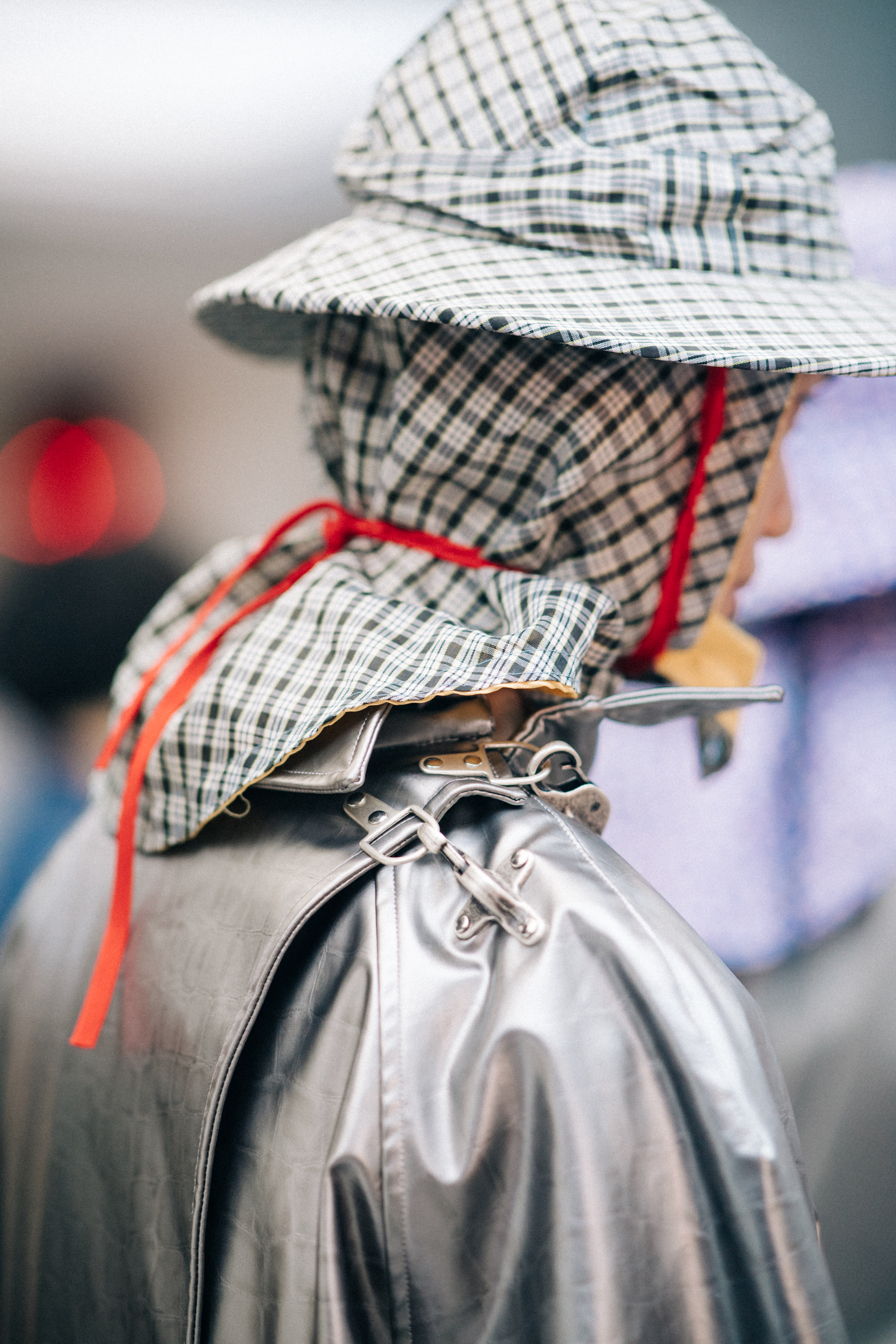 Male model wearing rain hat and coat
