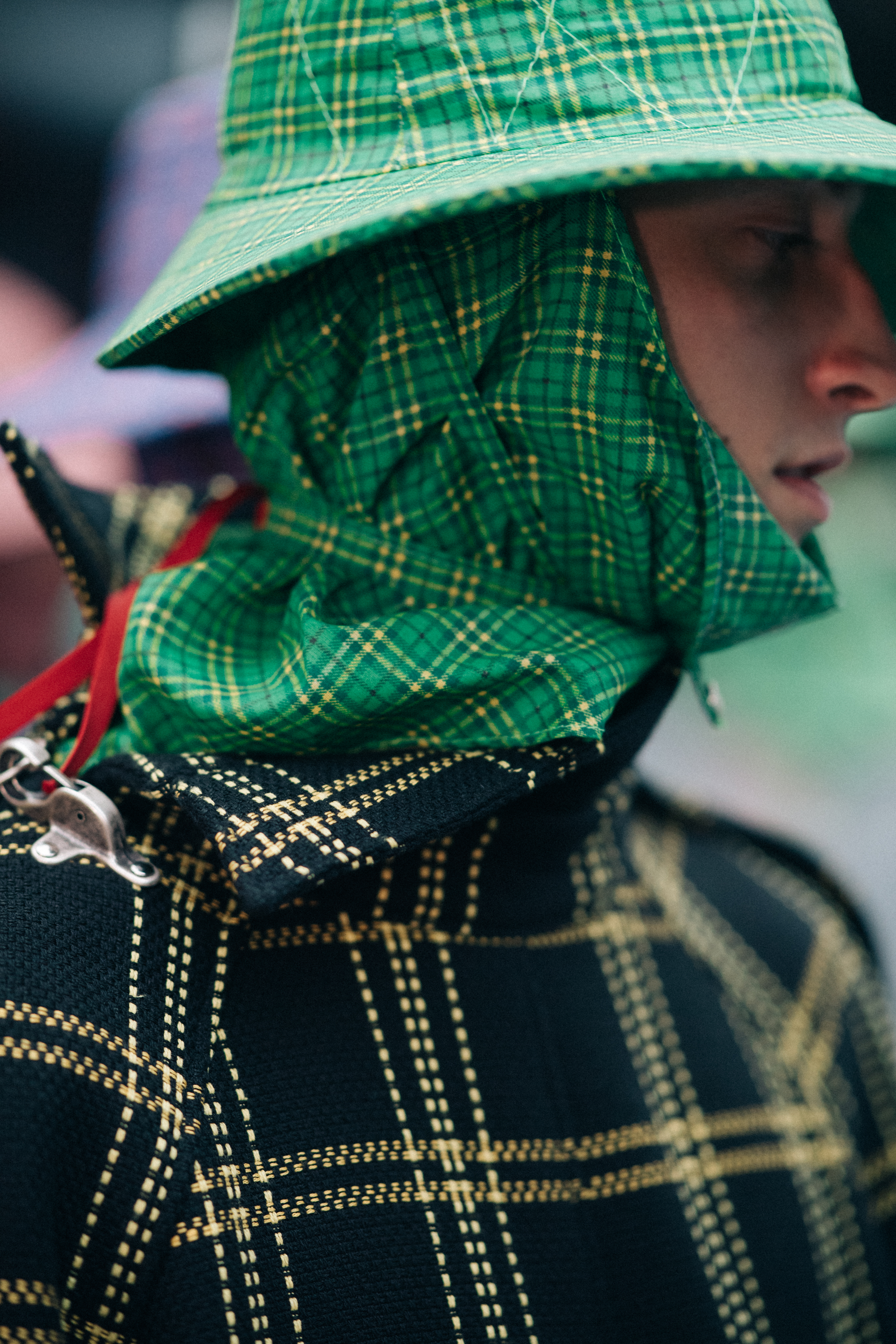 Male model wearing rain hat and coat