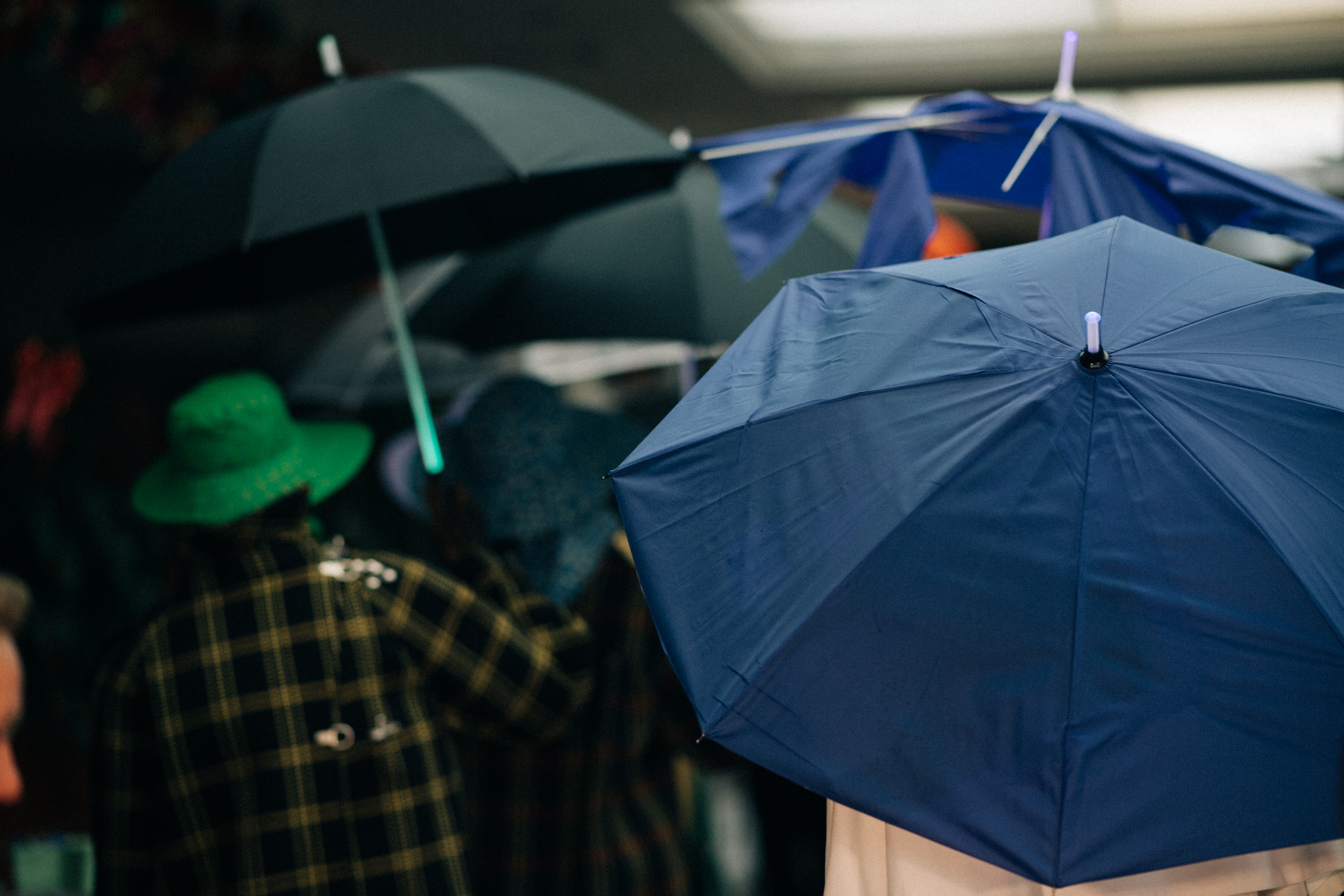 Group of models with umbrellas