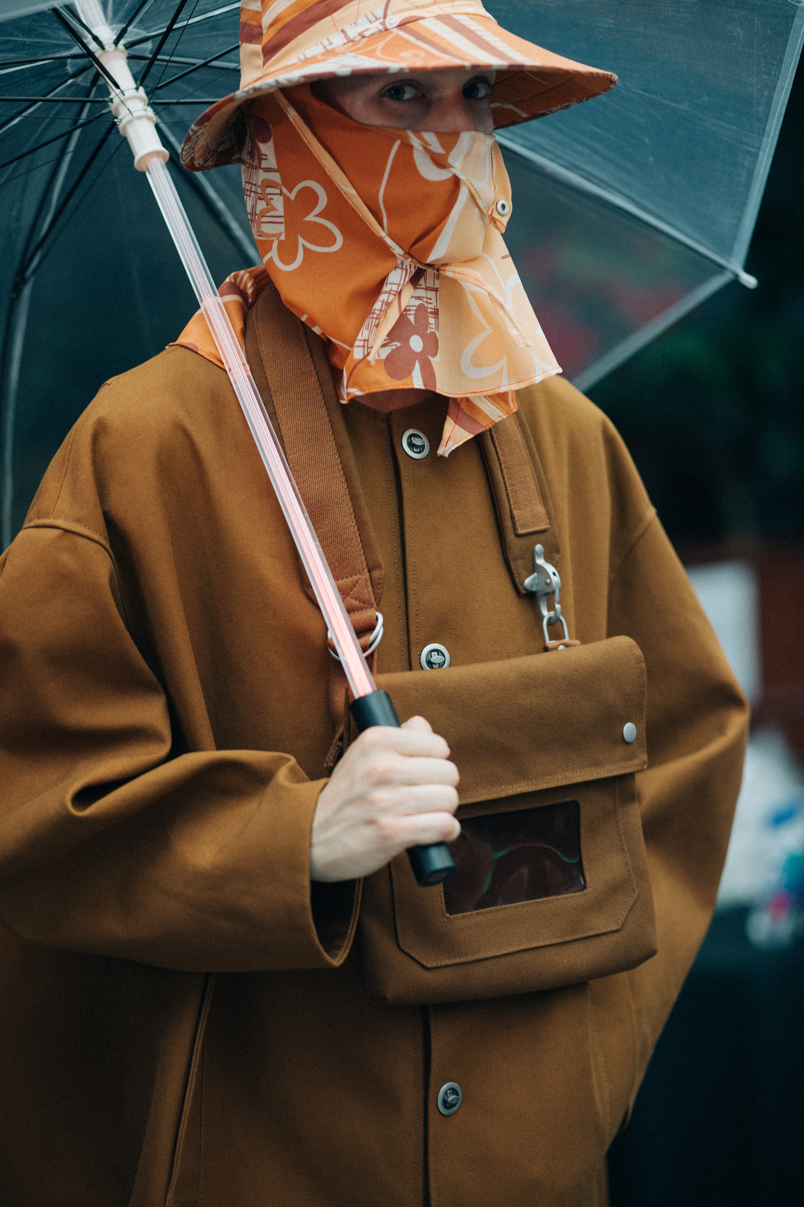 Male model wearing orange head piece