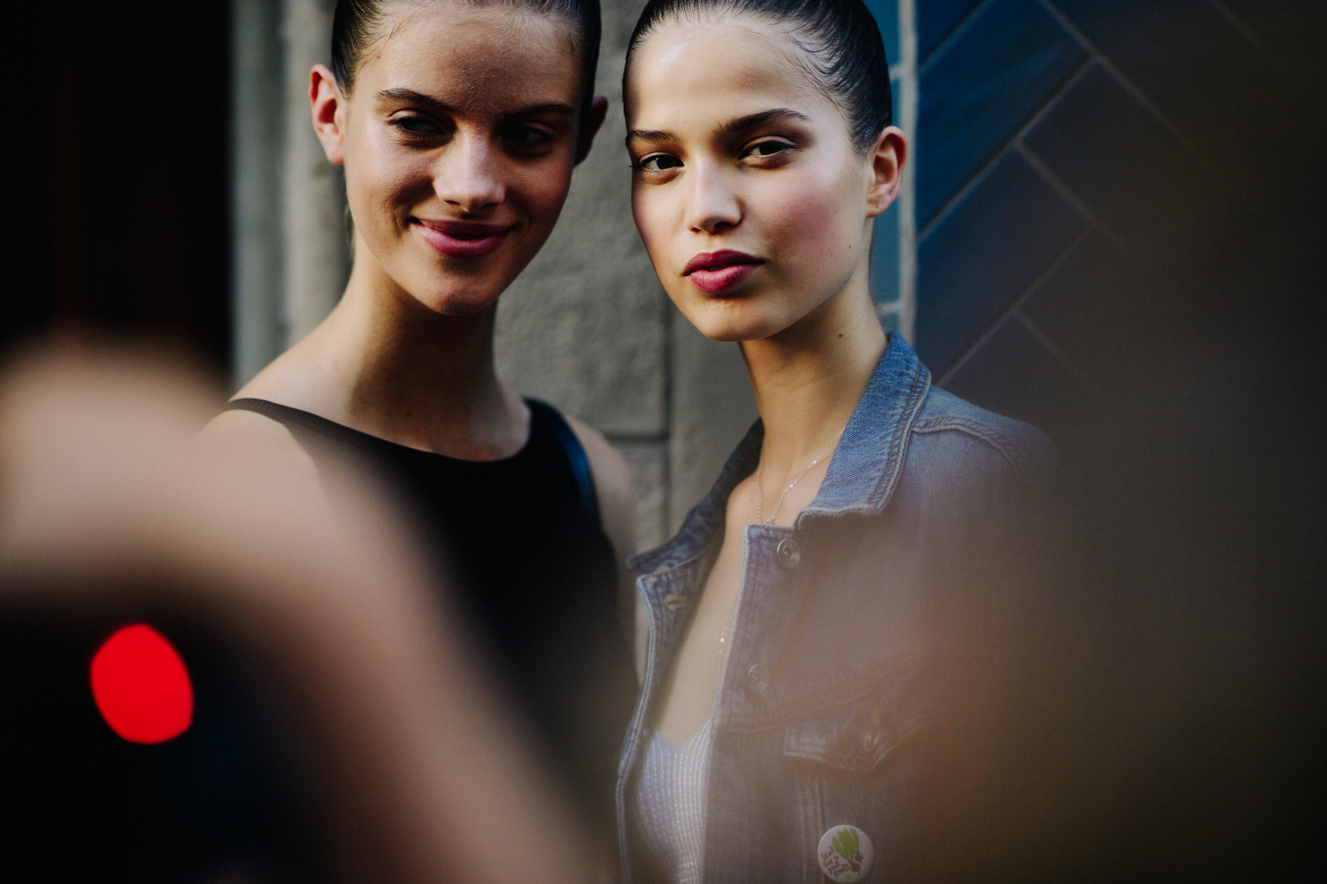 Two models posing together