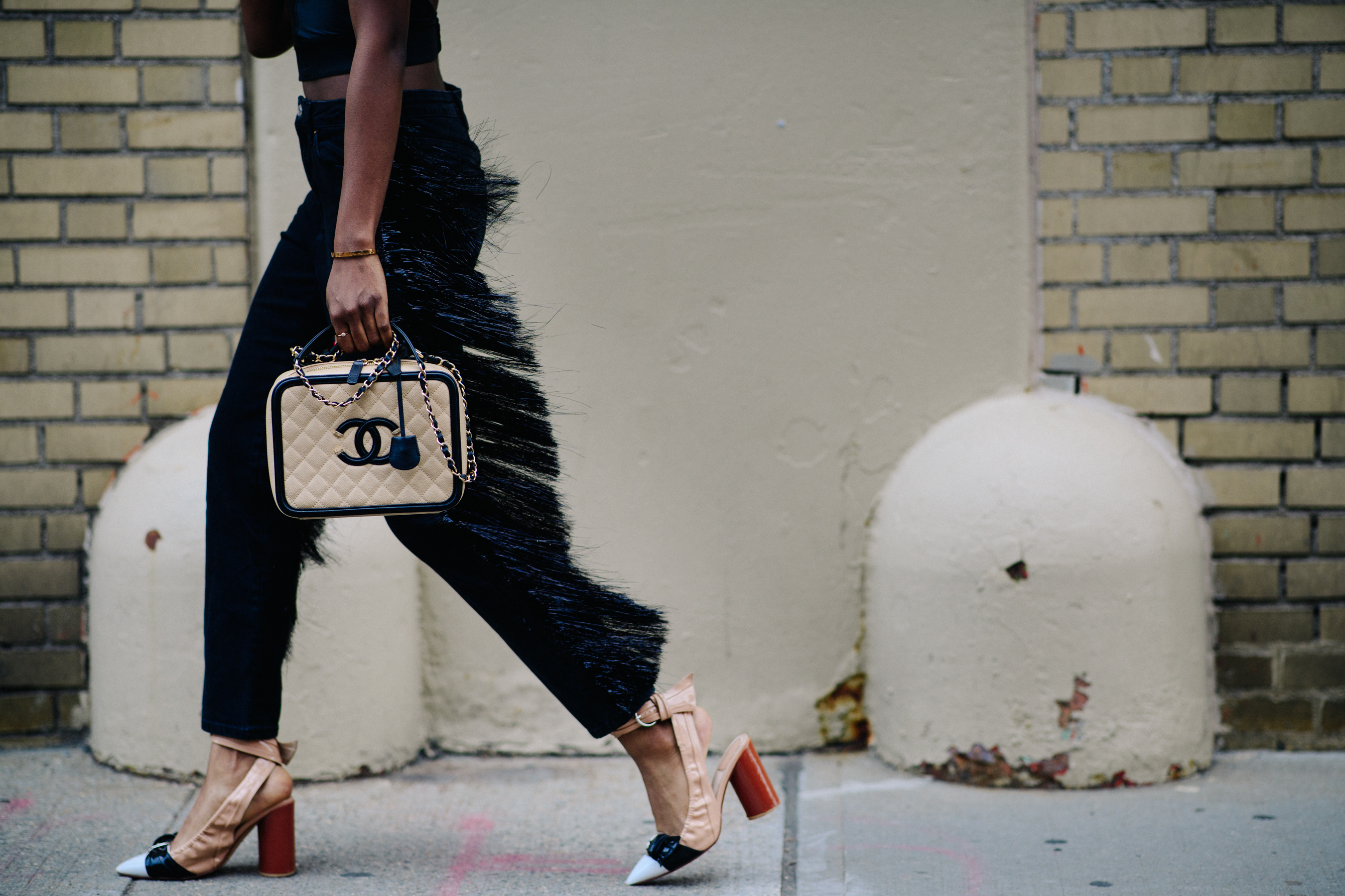 Woman wearing Chanel and Louis Vuitton