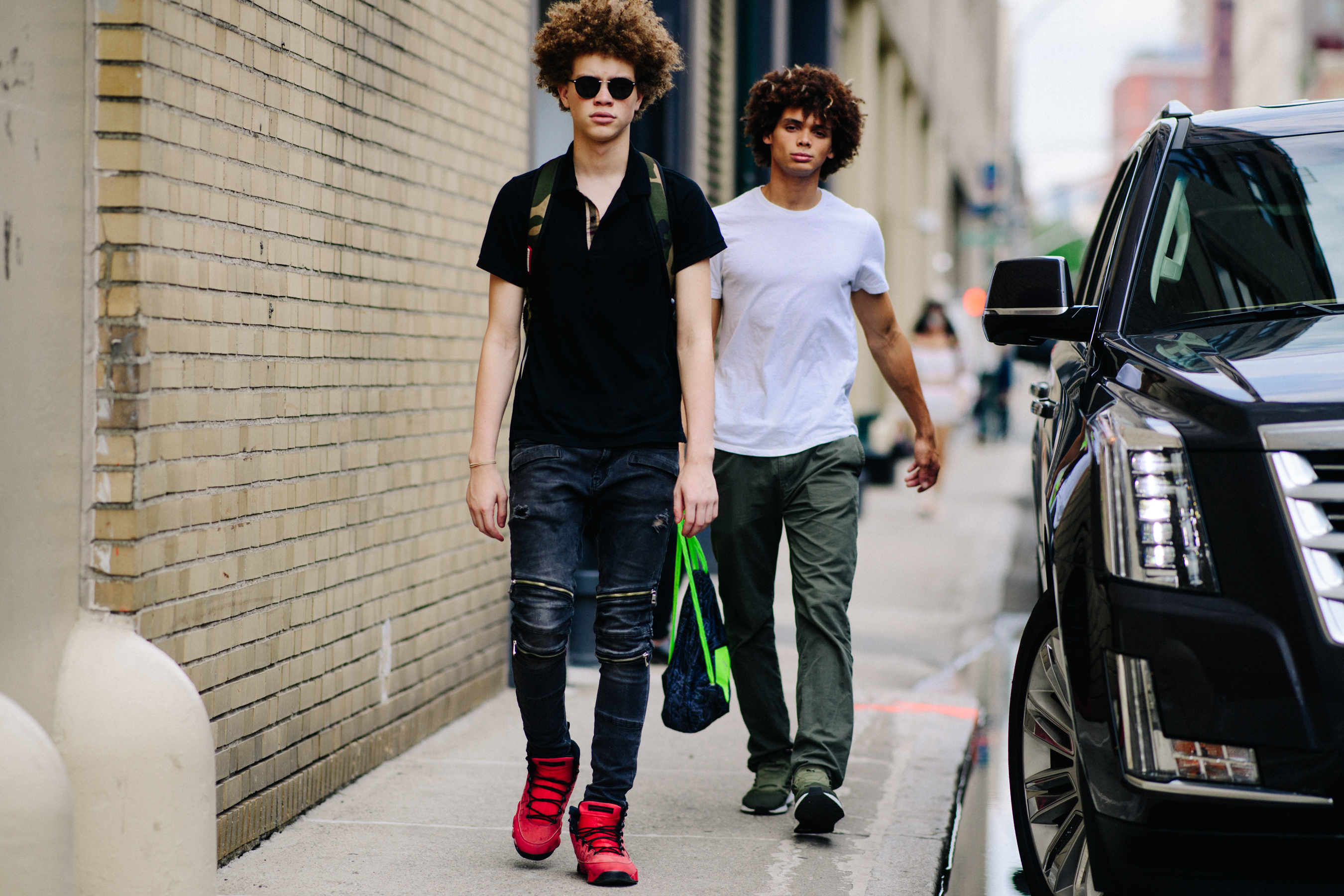 Two male models with curly hair
