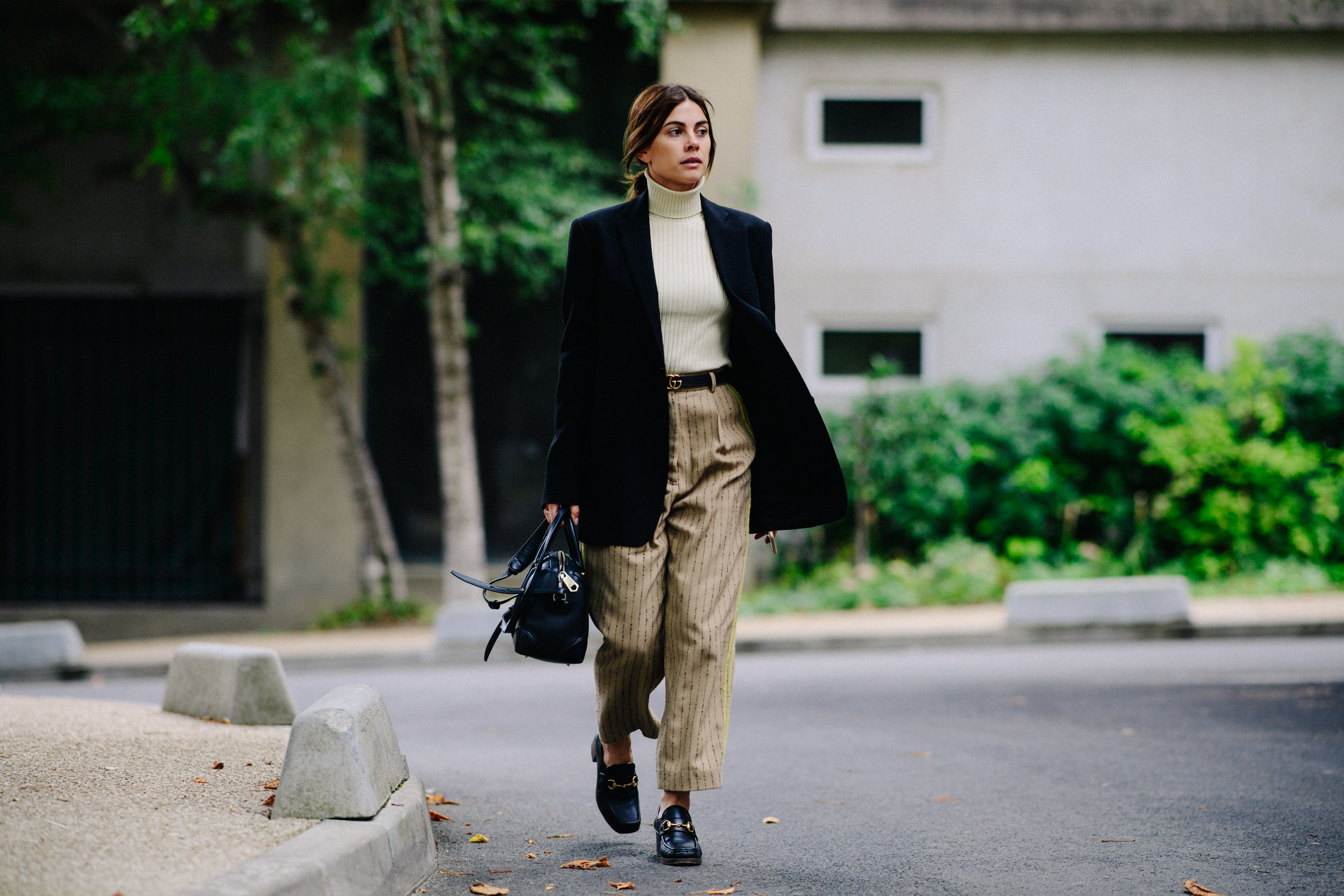 Woman wearing Gucci belt and loafers