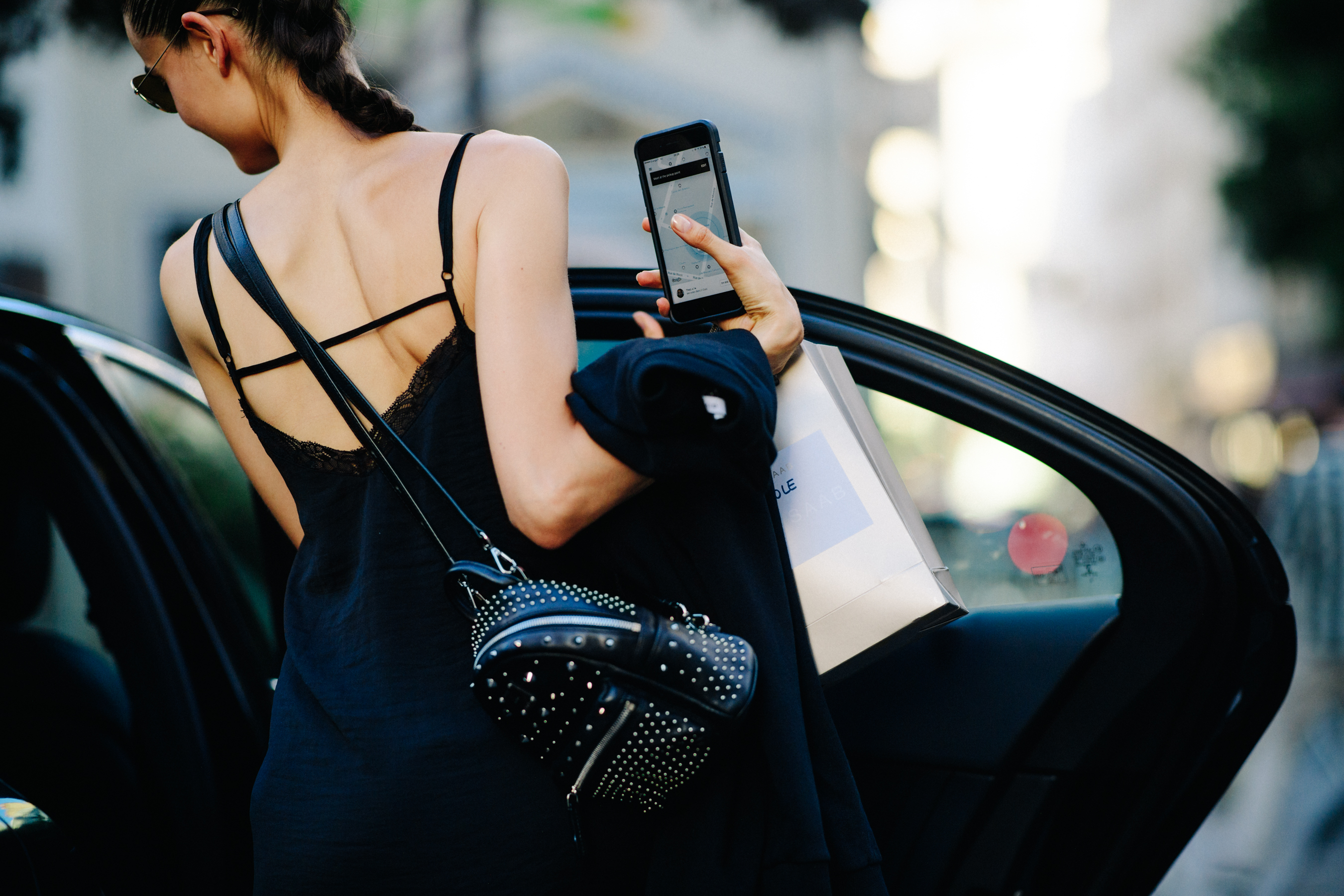 Woman with a studded backpack