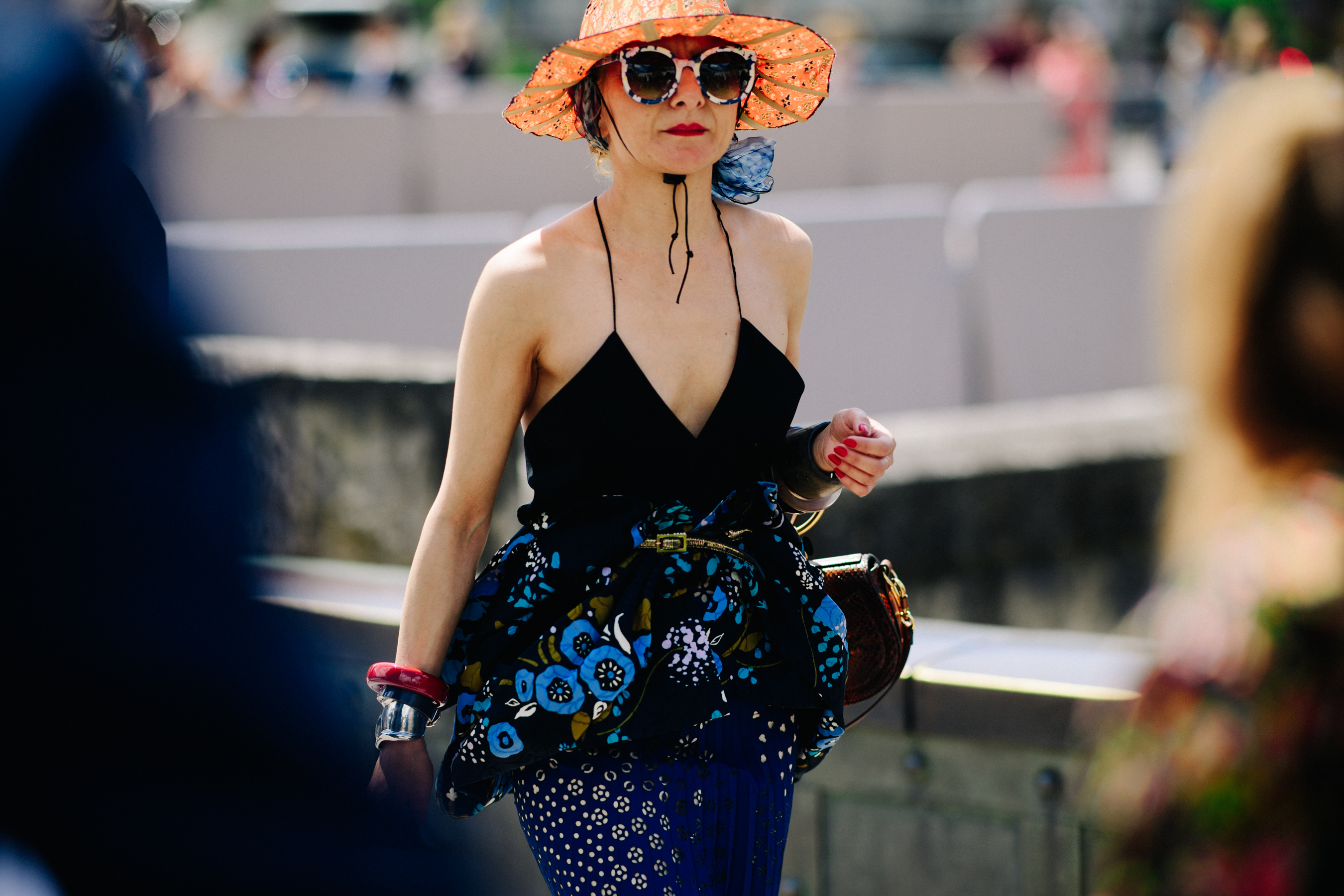 Stylist wearing black dress and hat