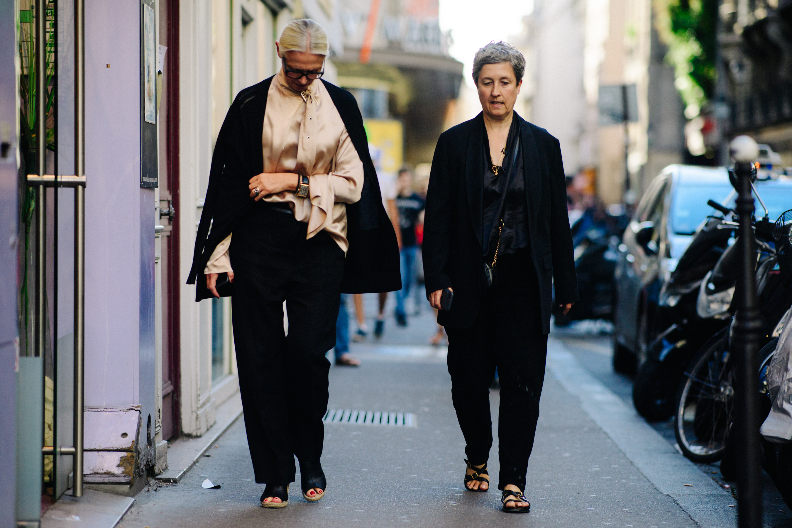Two women wearing black jackets