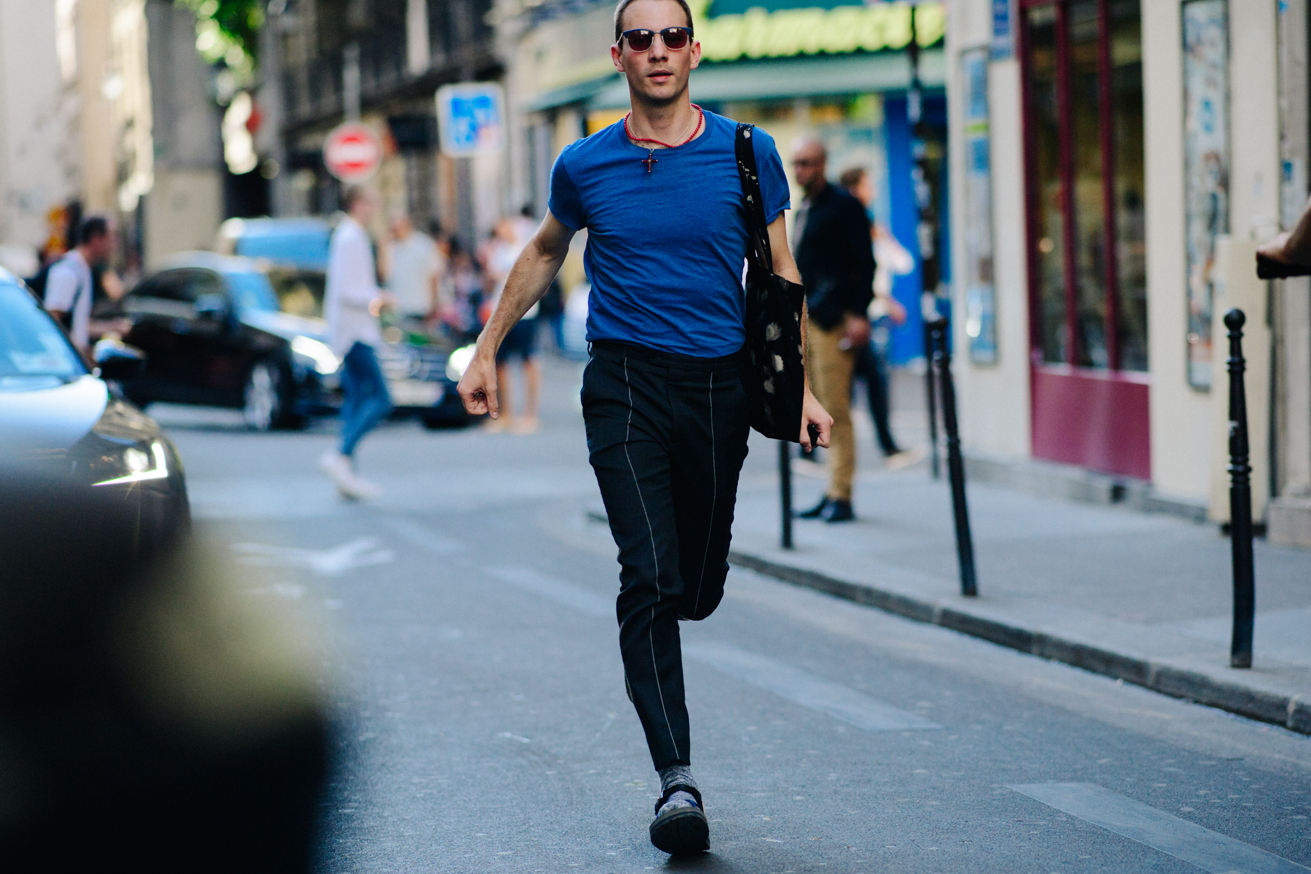 Editor wearing a dark blue t-shirt