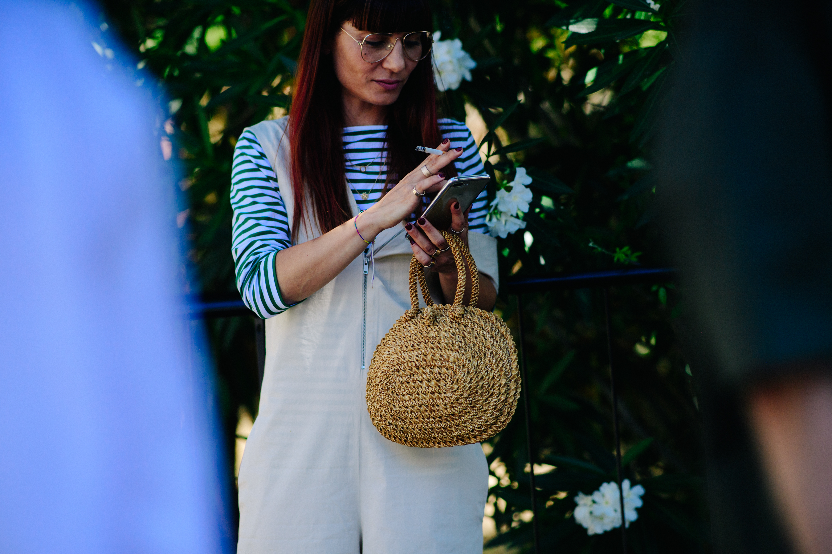 Woman carrying a yellow straw bag