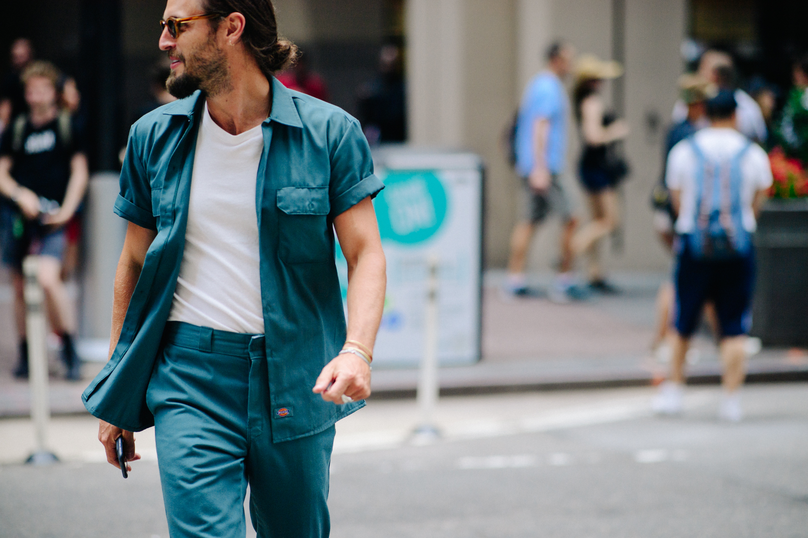Man ewaring blue suit with t-shirt