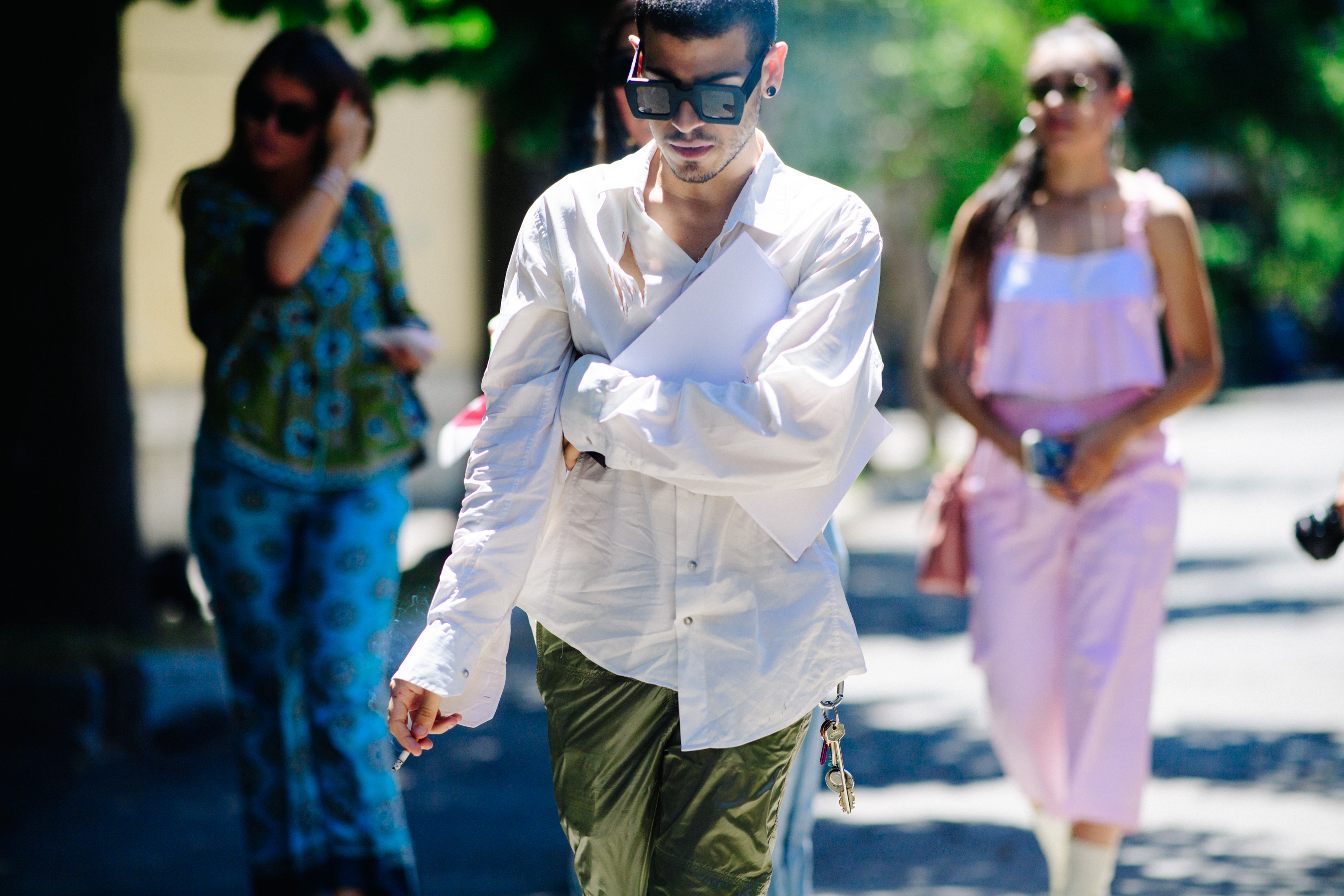 Man wearing square black sunglasses