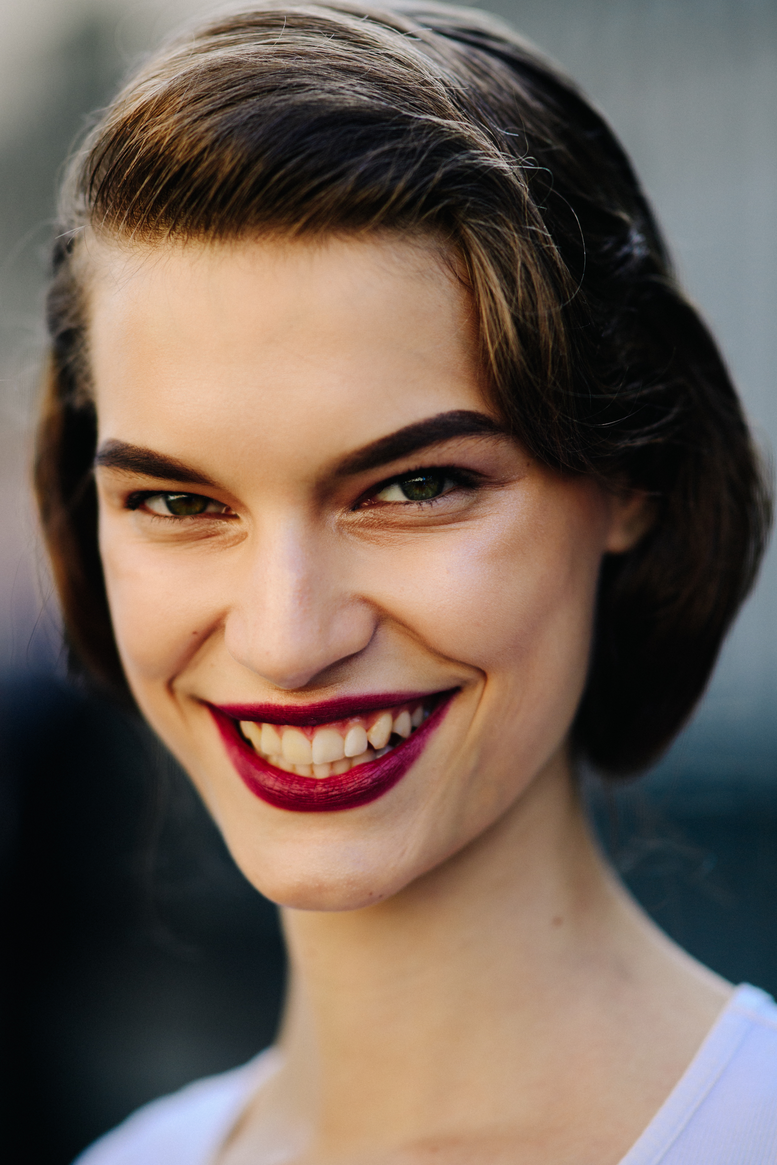 Model wearing red lipstick make up