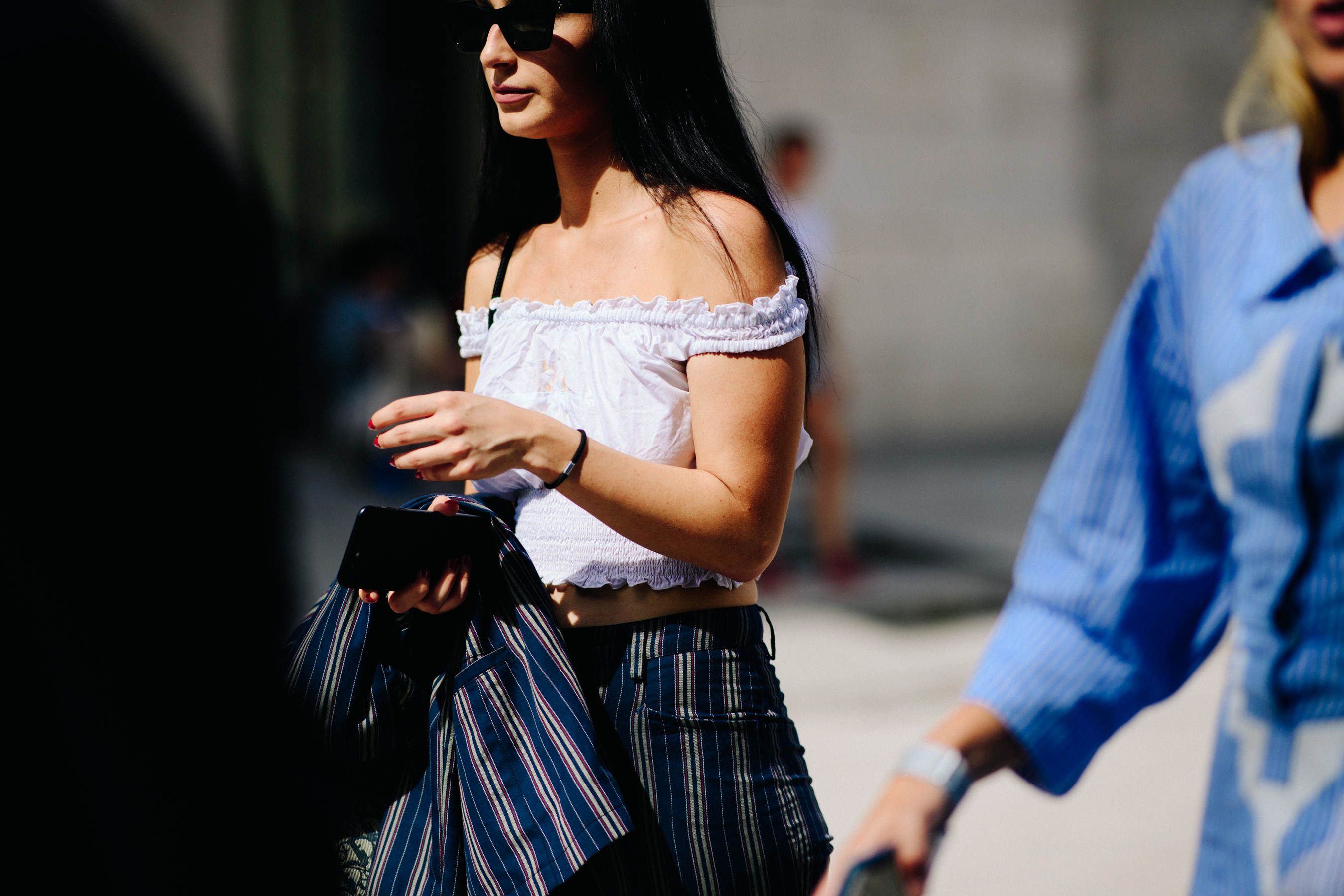Woman wearing striped blue pants