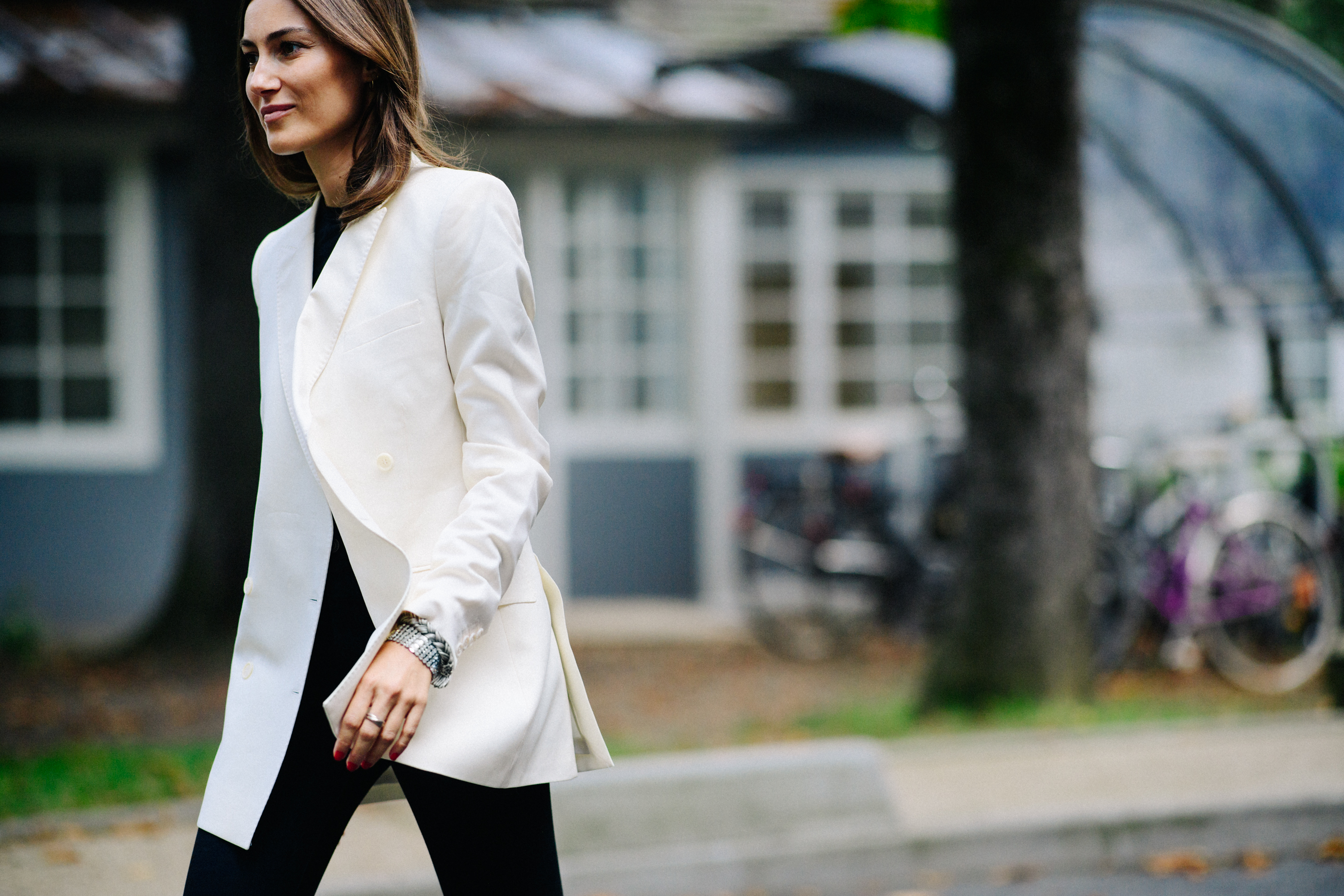 Italian fashion consultant wearing white blazer