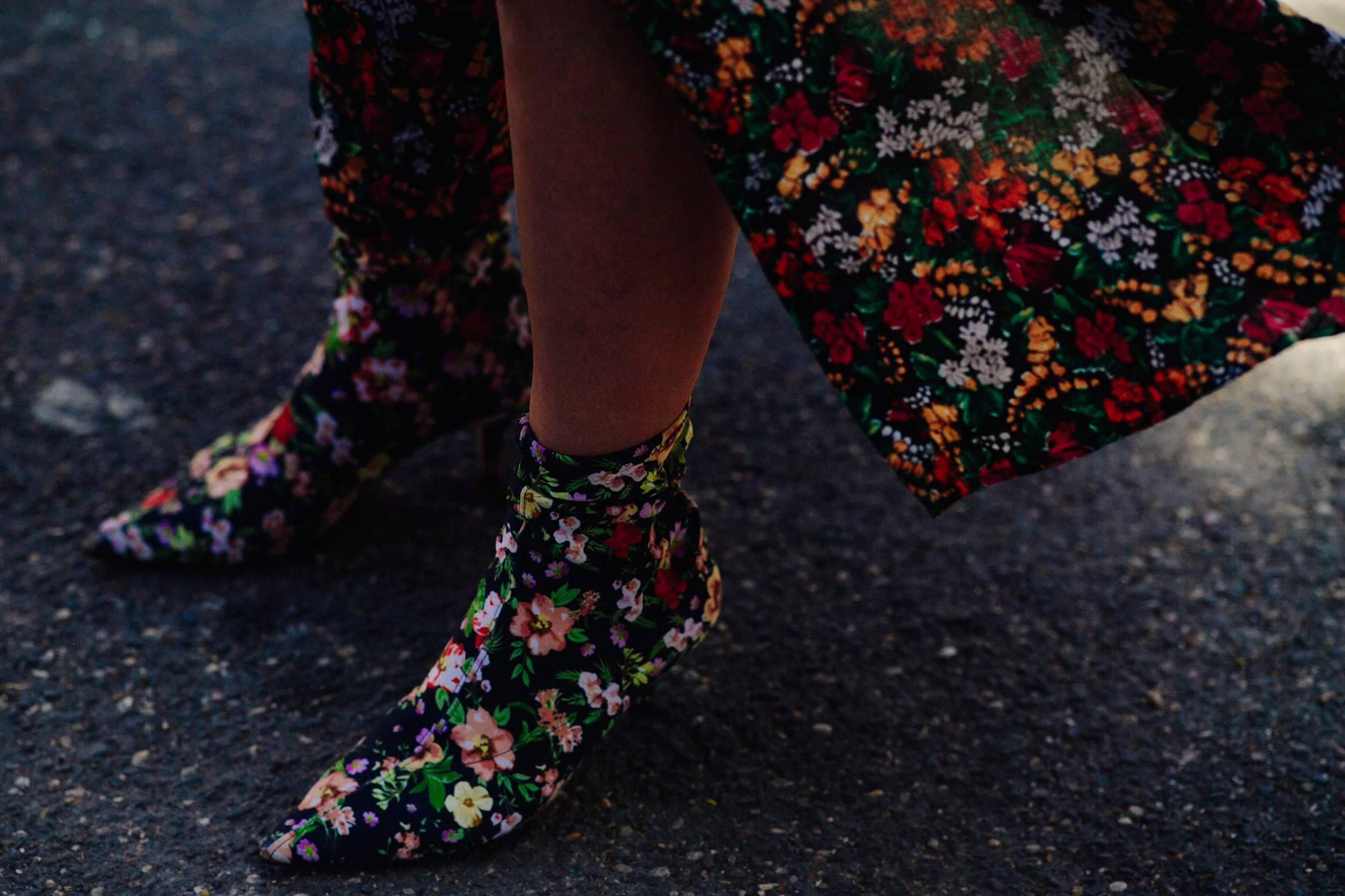 Woman wearing flower print shoes