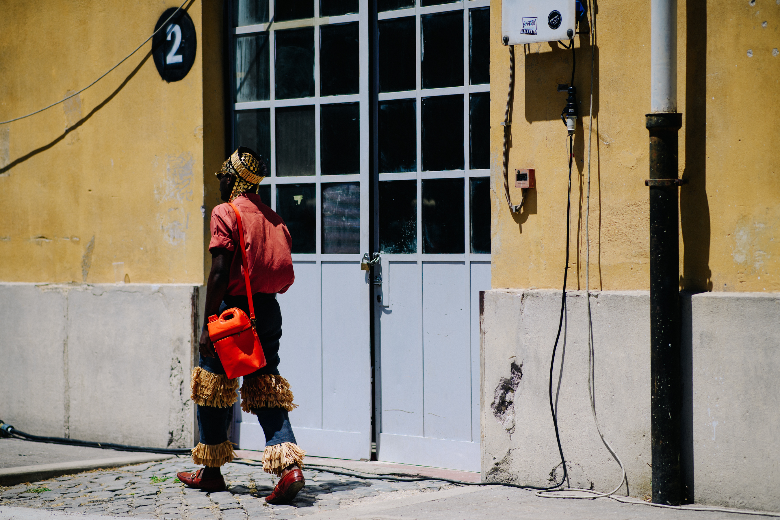 Man carrying an orange bag