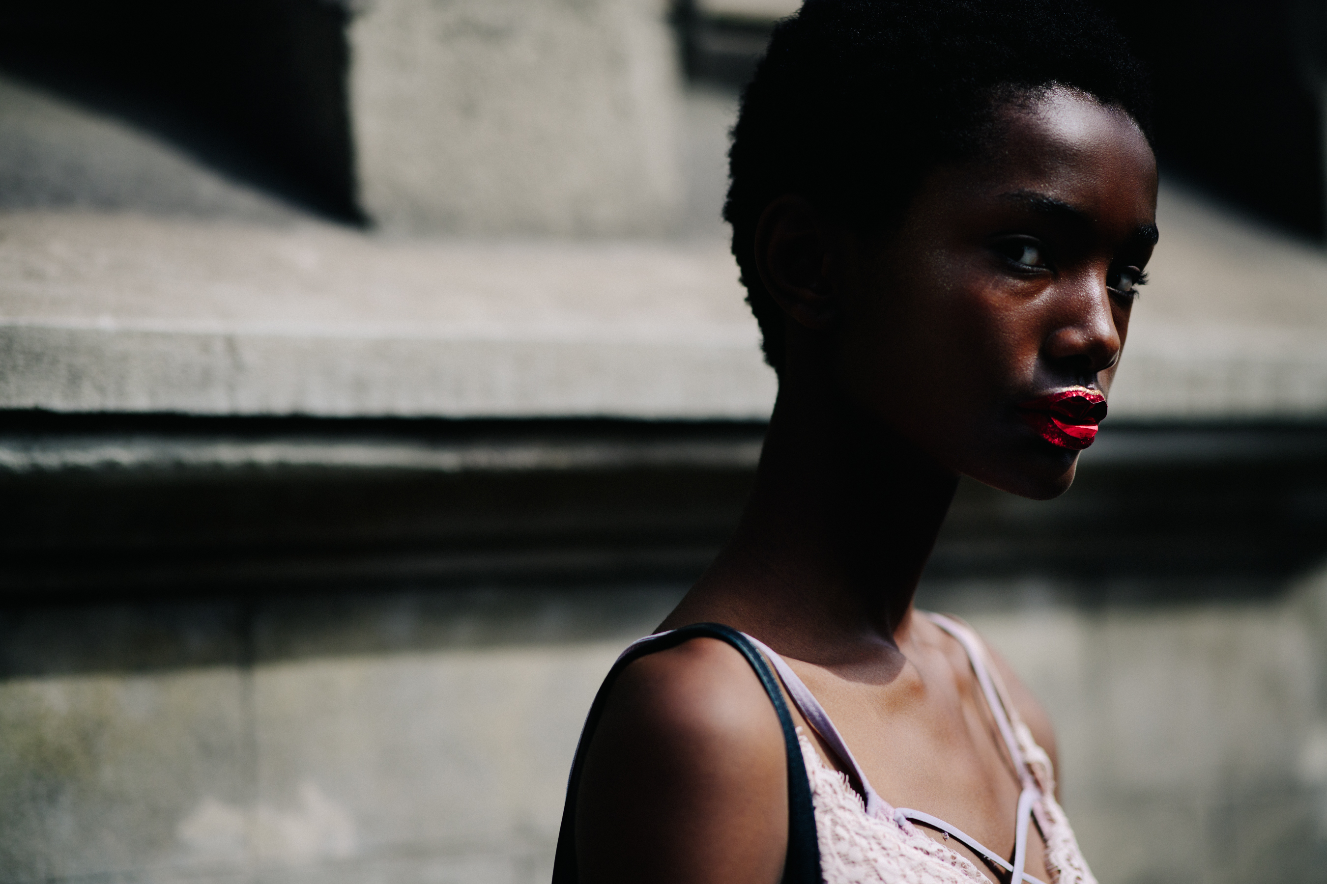 Model wearing a red lip accessory