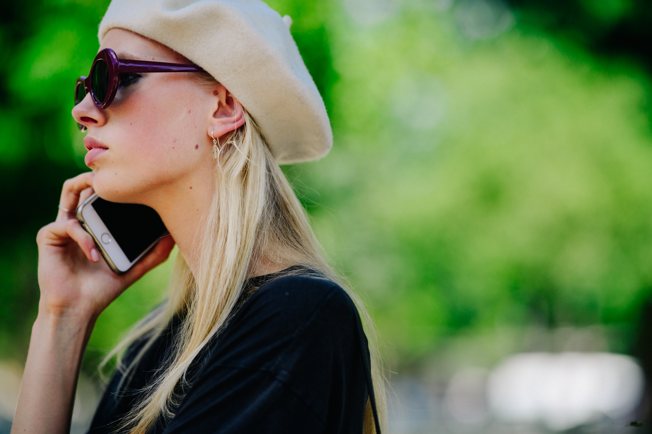 Model wearing glasses and beret
