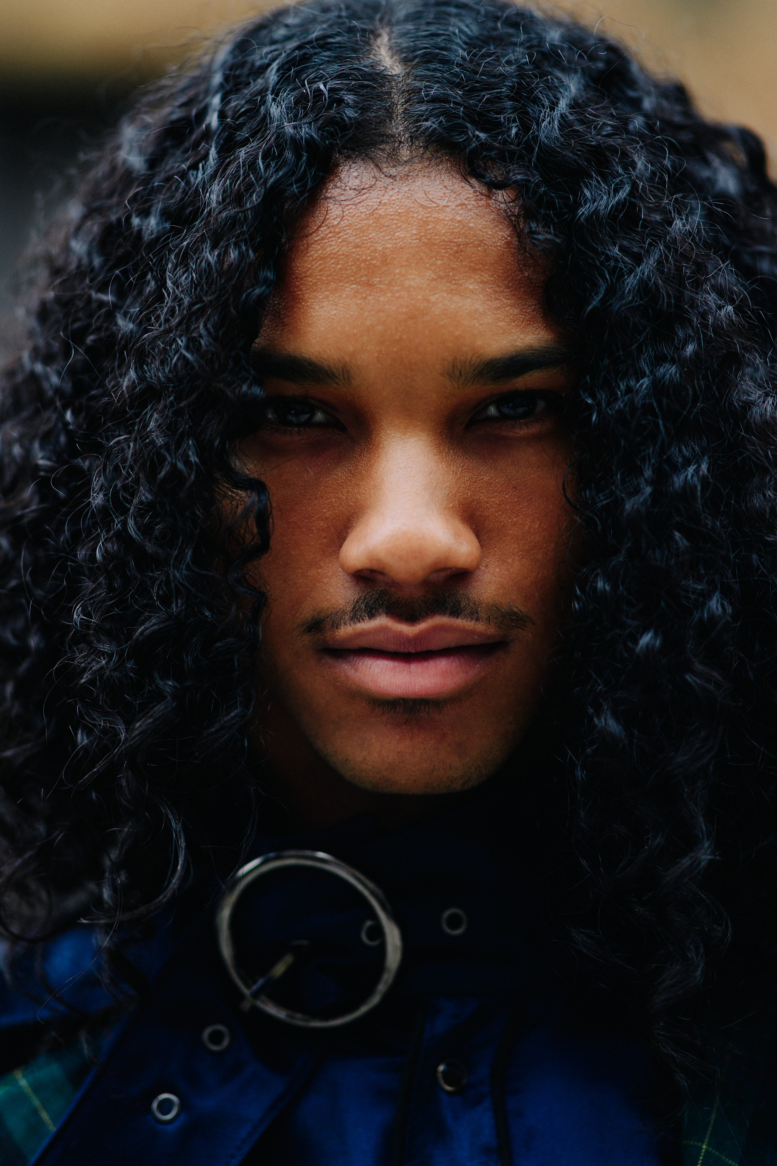 Male model with long curly hair