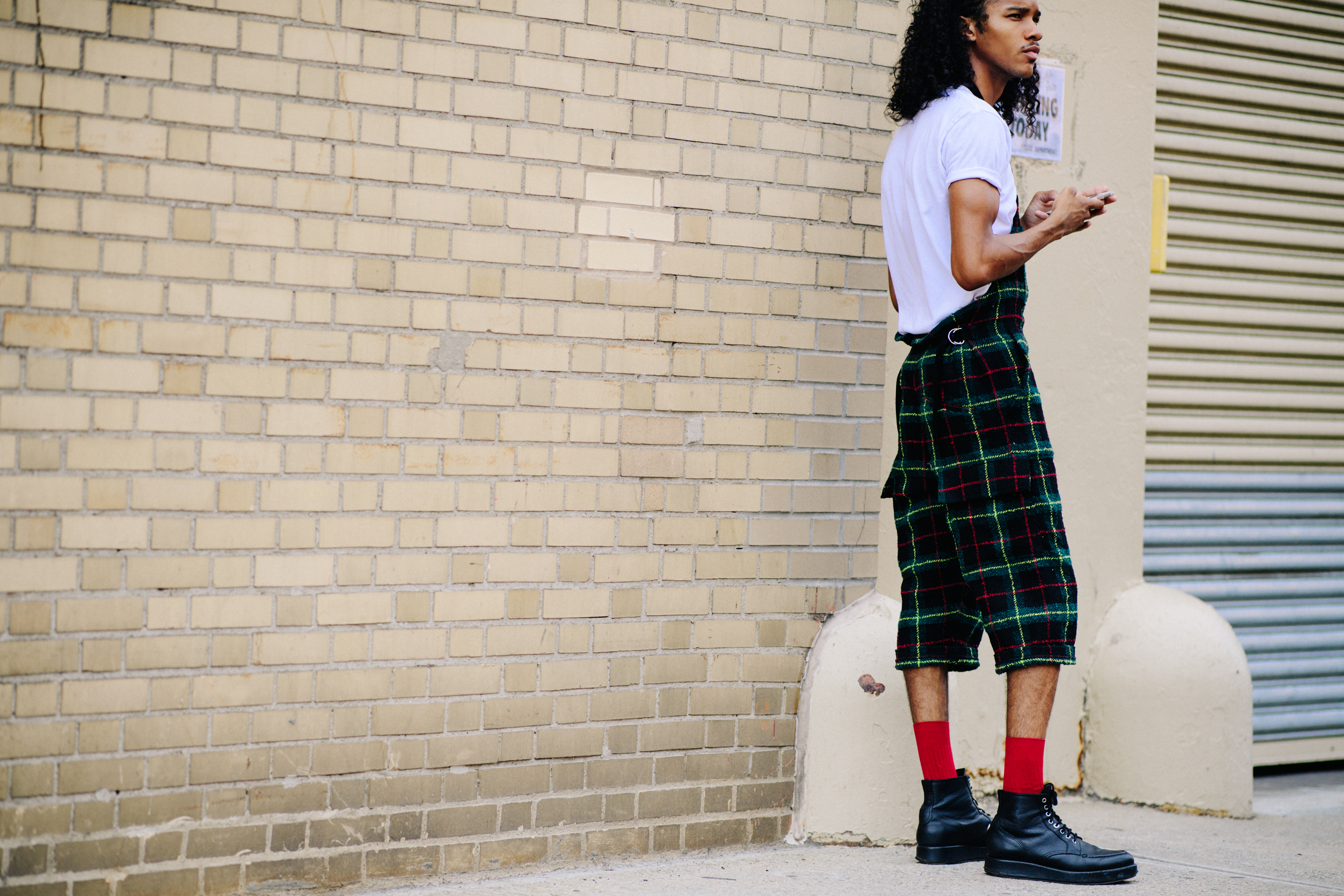 American male model wearing black sneakers