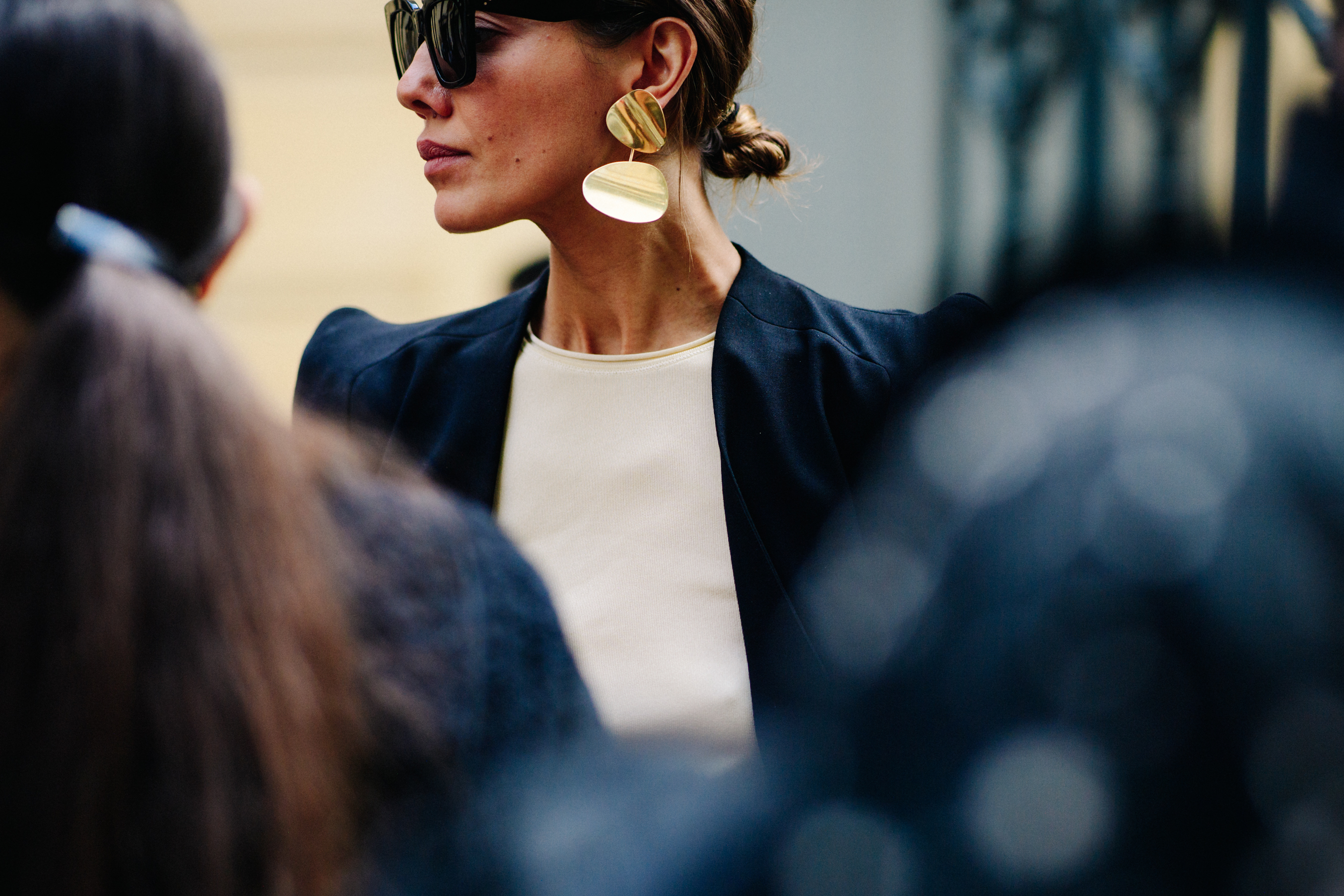 Ukrainian VOGUE editor wearing gold earrings