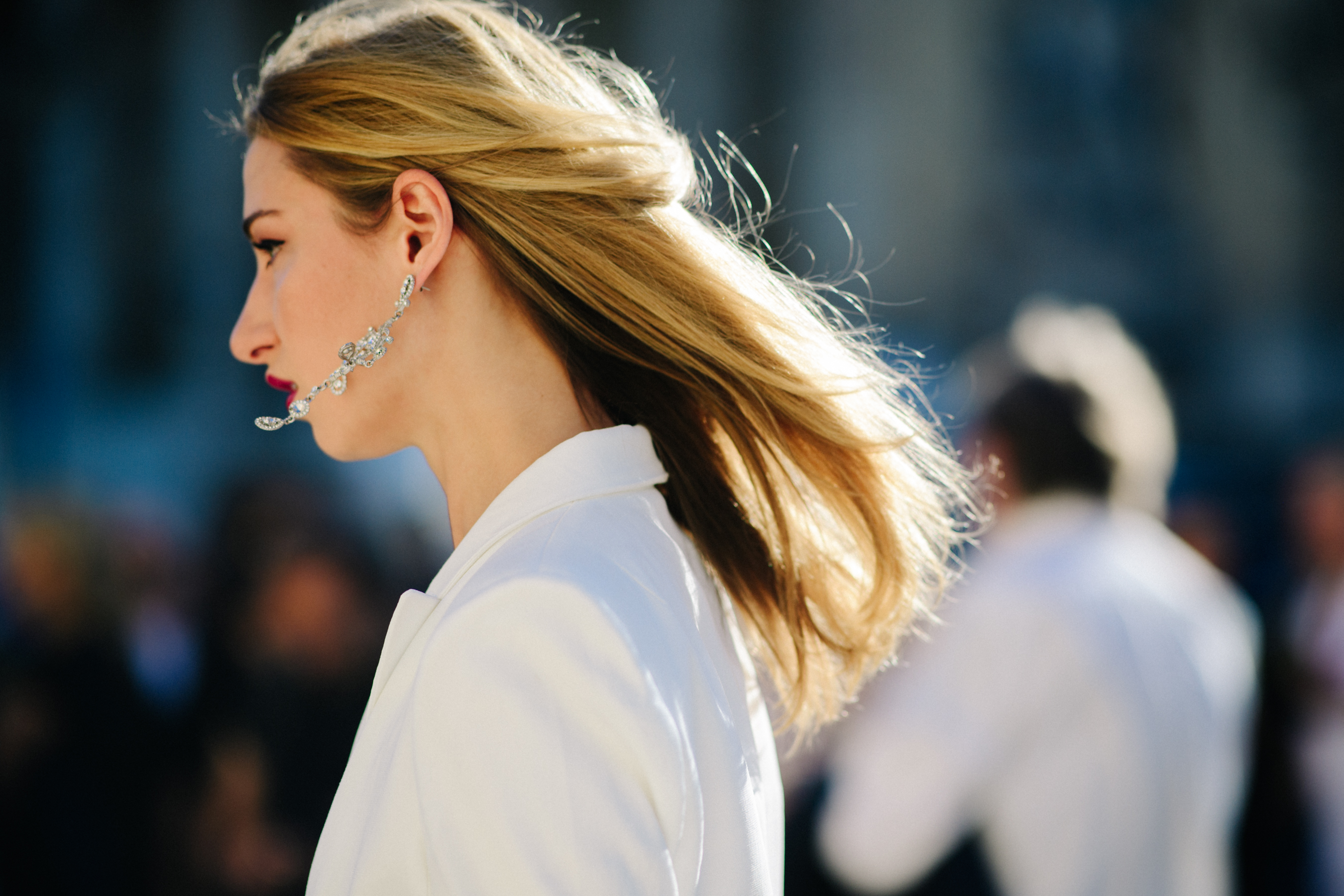 Woman wearing white blazer dress