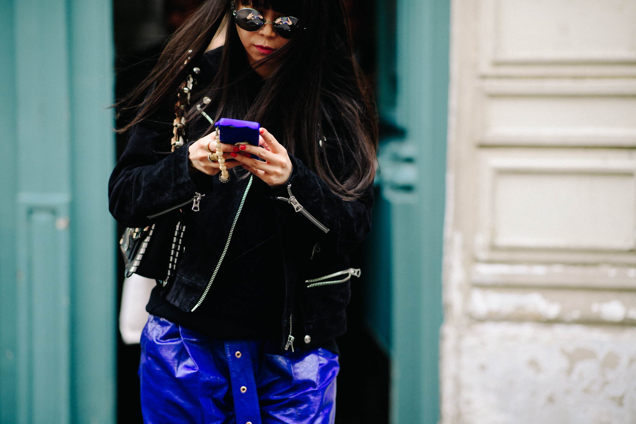 Woman wearing blue leather pants