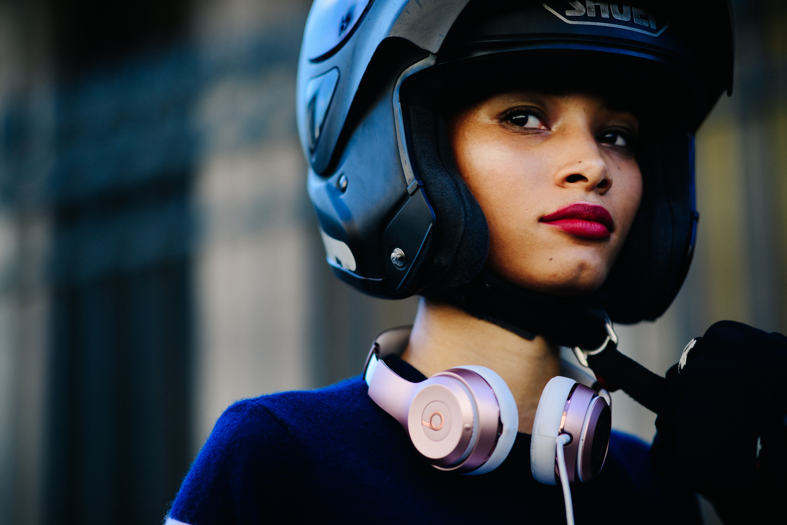 Model wearing scooter helmet after Ulyana Sergeenko